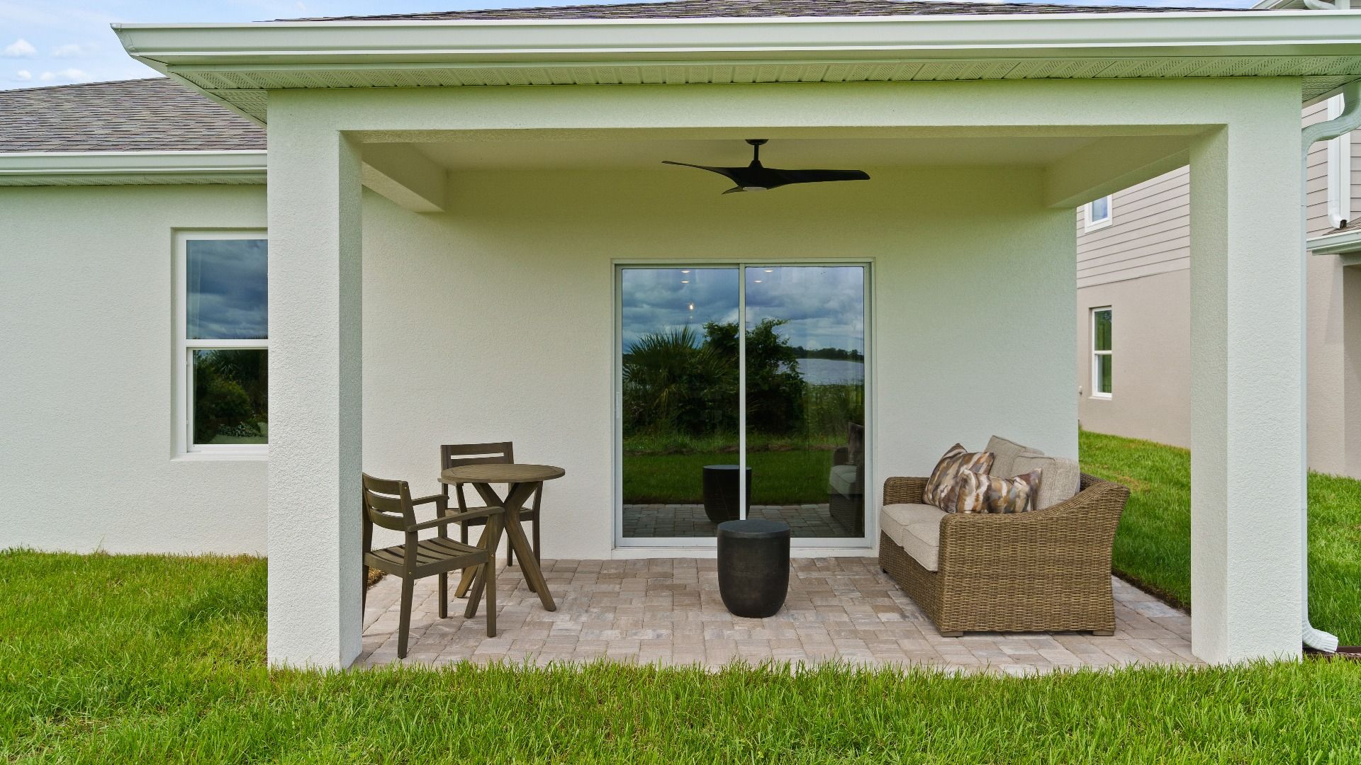 Castaway Model Rear Exterior with covered lanai by DRB Homes, plan available in Liberty Trace located in Haines City, FL.