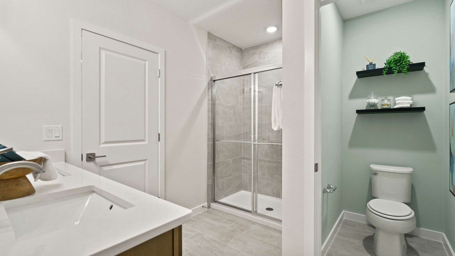 Castaway Model Home Primary Suite, en suite bath with dual sinks new home plan available at Liberty Trace in Haines City, fl