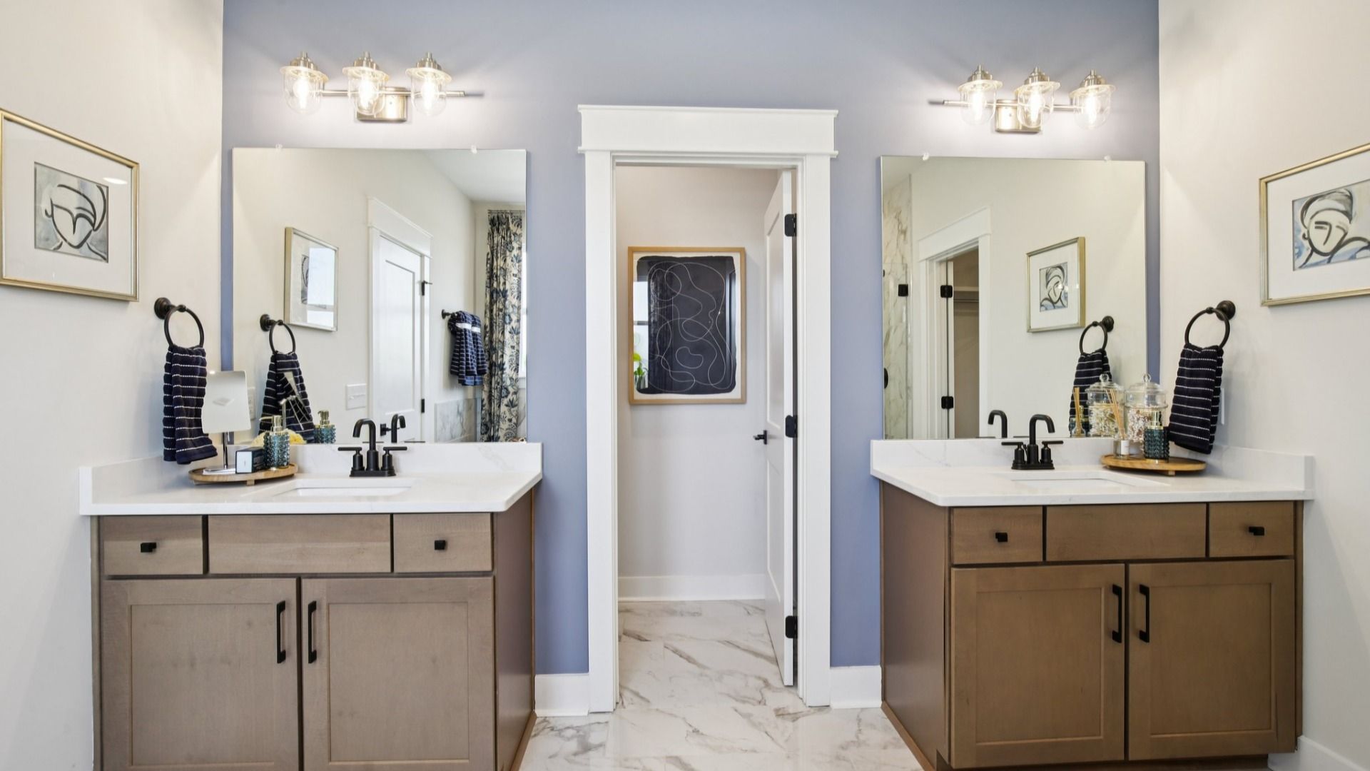Split dual vanities on either side of water closet, and nearby walk-in closet