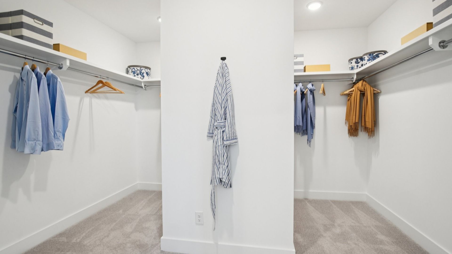 Large walk-in closet with built-in shelving and divided layout