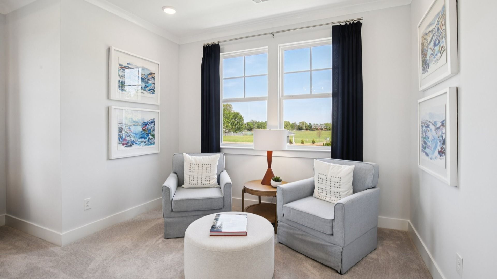 Well-lit Seating area in front of bedroom windows
