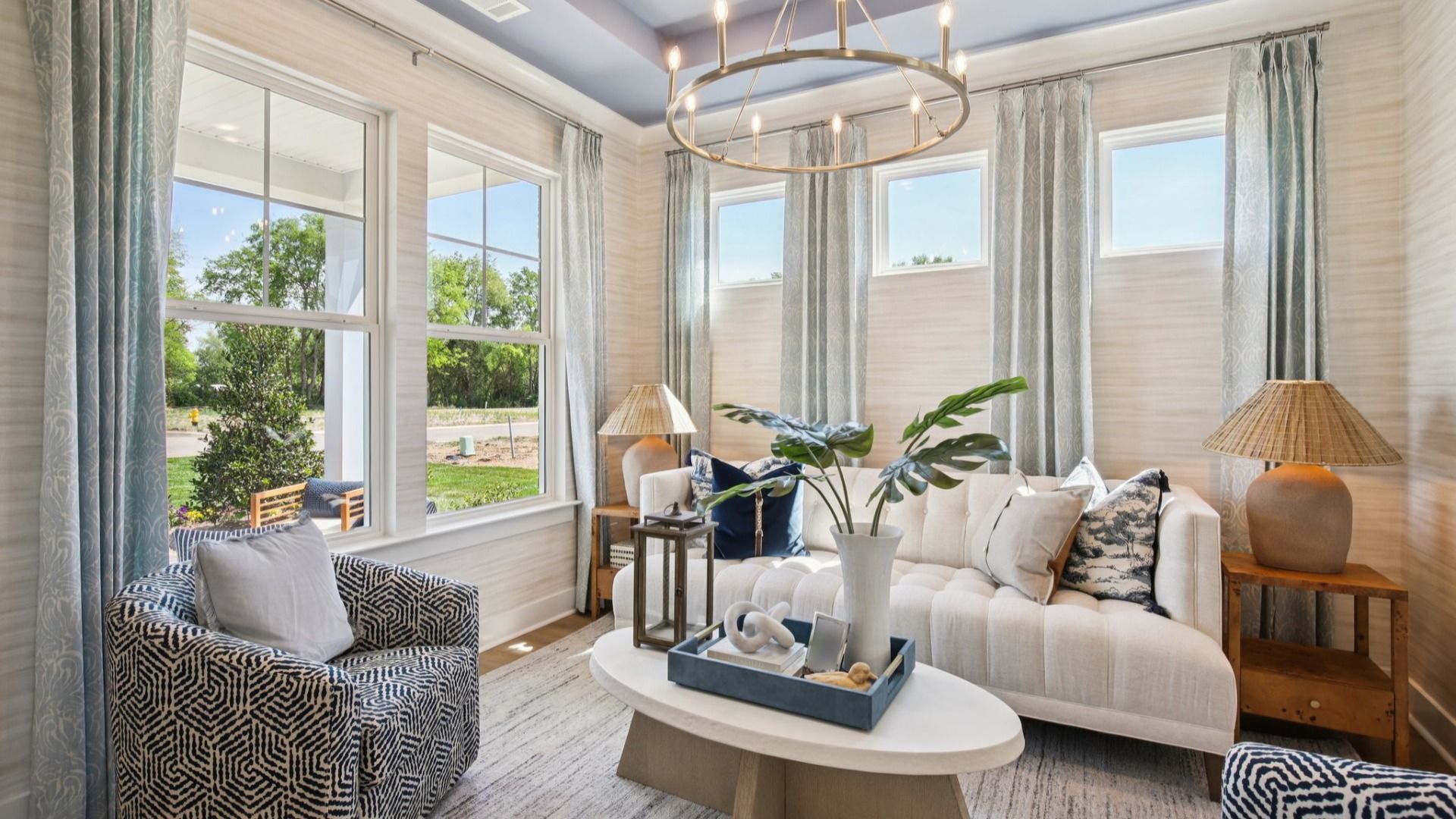 Flex room staged as a formal living room or seating area with chandelier