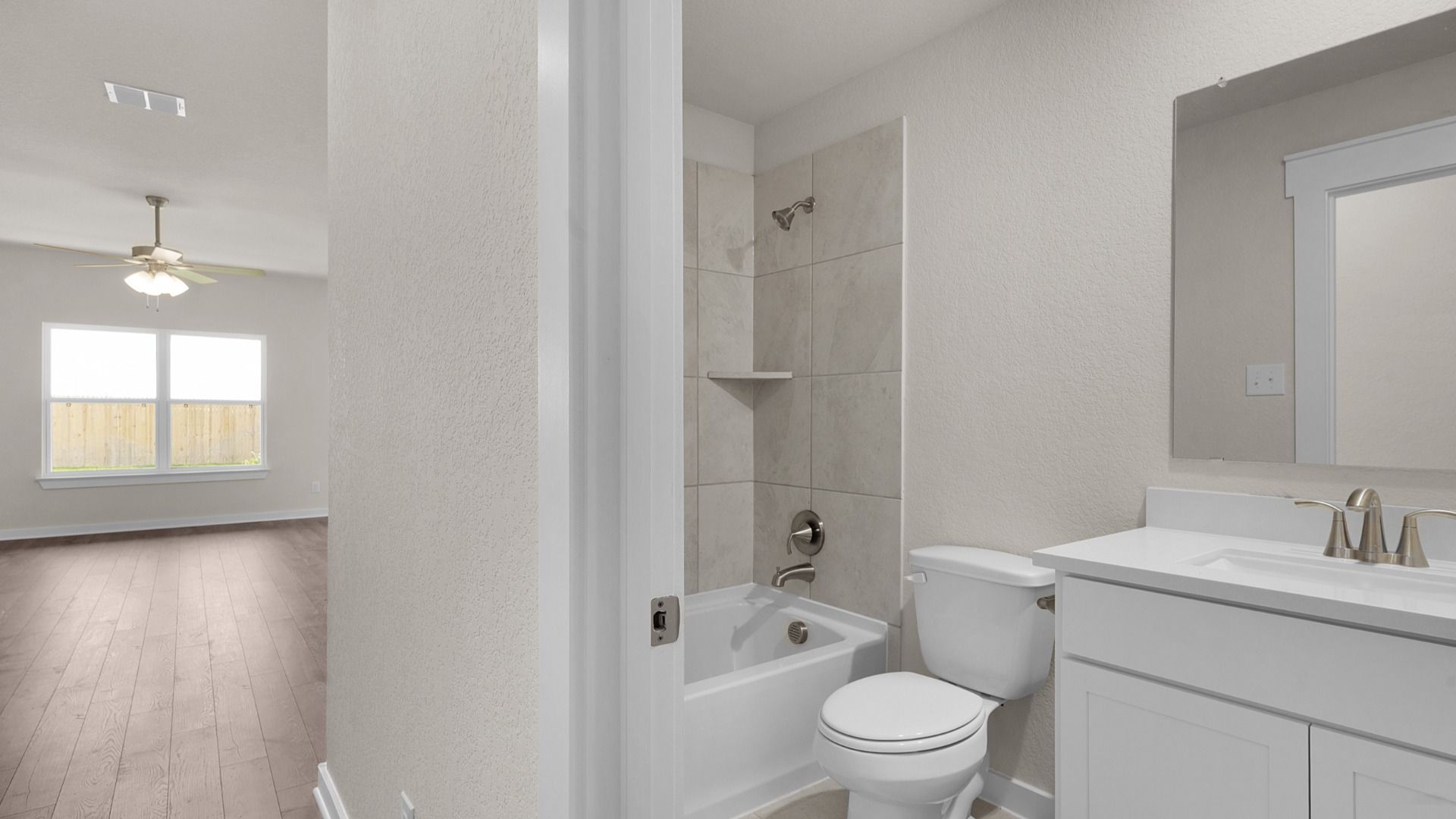 Secondary Bath with Tub/Shower Combo with Tile Surround, Single Vanity with White Vanity Top