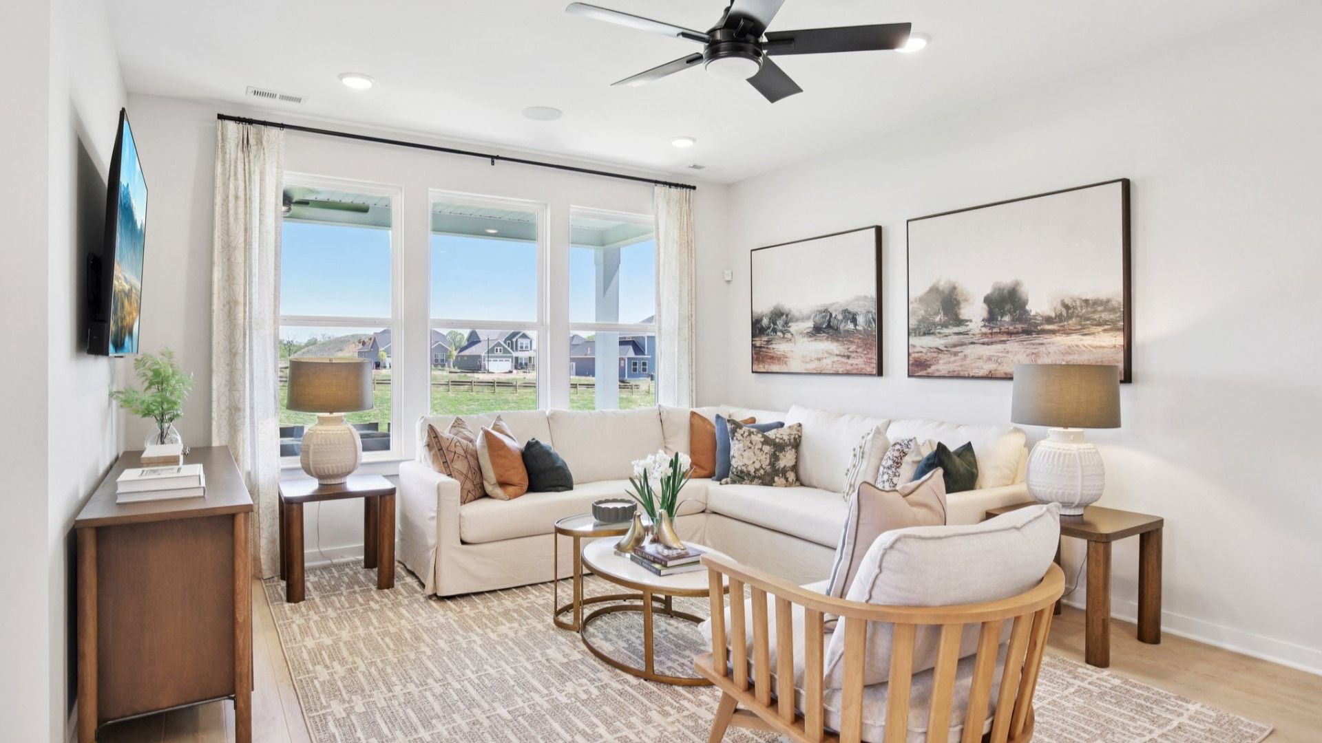 Well-lit living room area near kitchen and dining areas