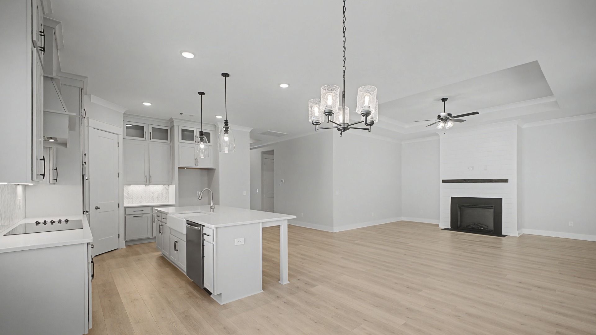 Large kitchen with floor to ceiling cabinets and kitchen island