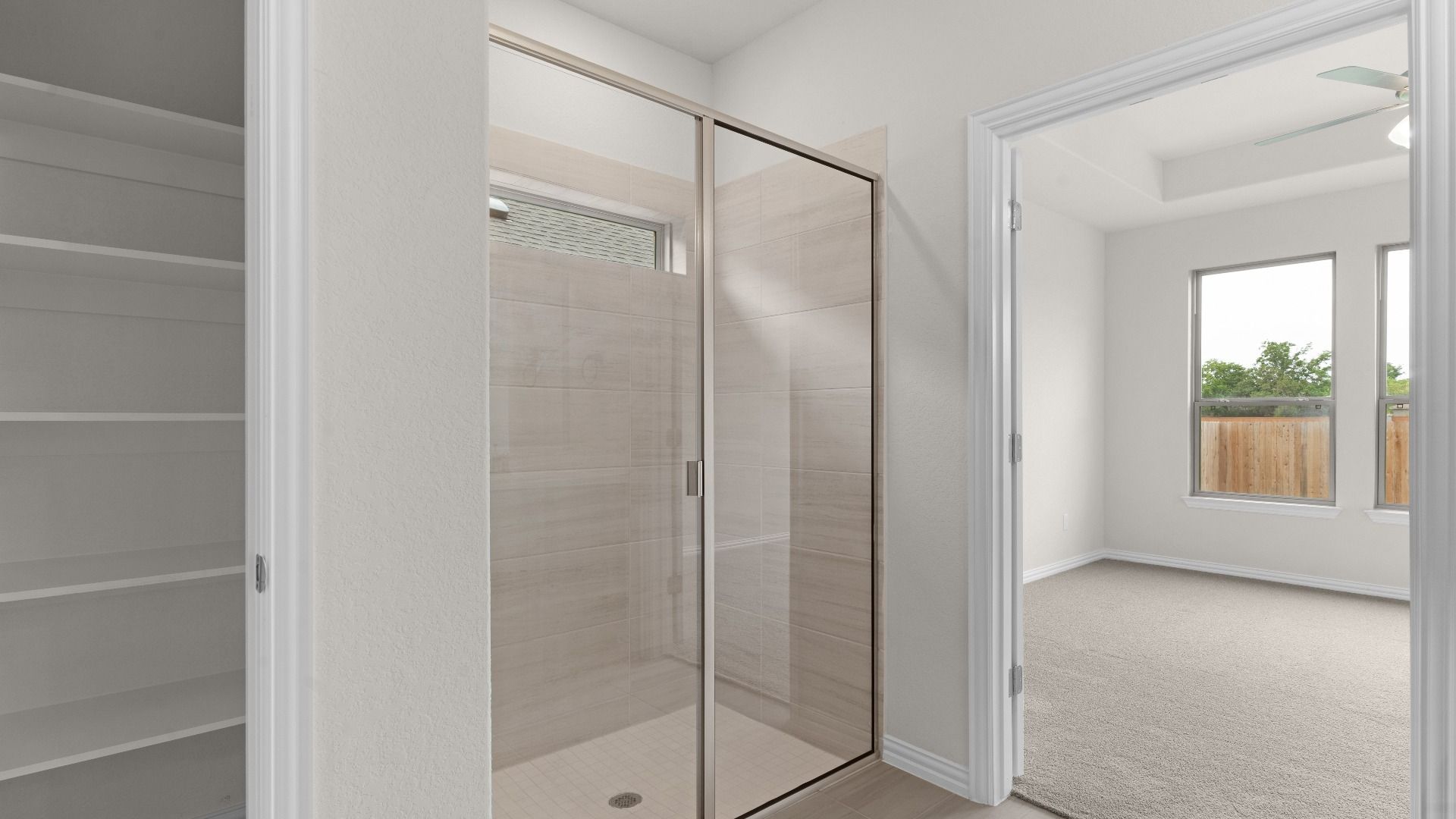 Owner's Bathroom with Dual Vanity, Ceramic Tiled Shower, Closet, Window