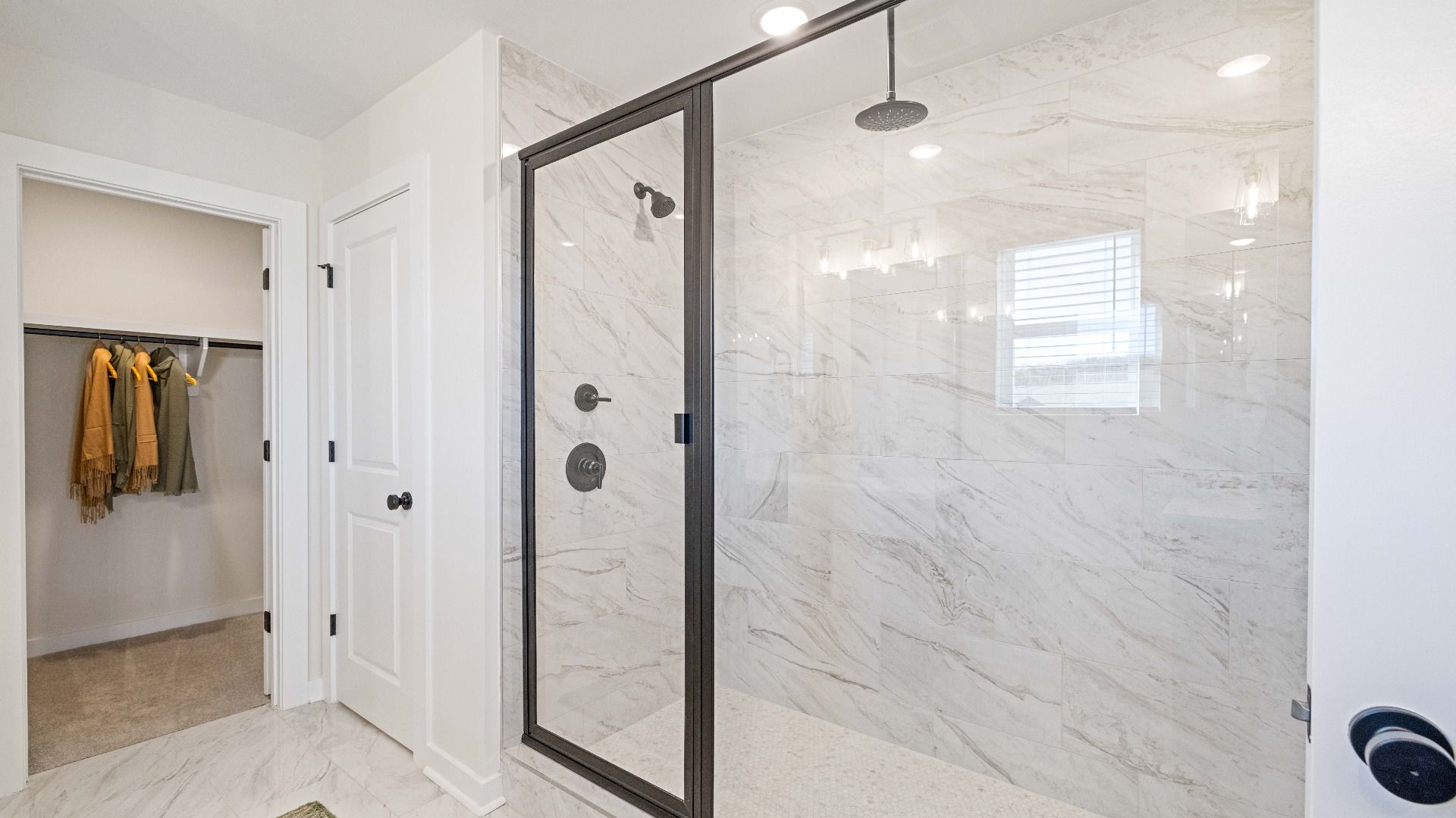 Tile Shower with glass enclosure and walk-in closet