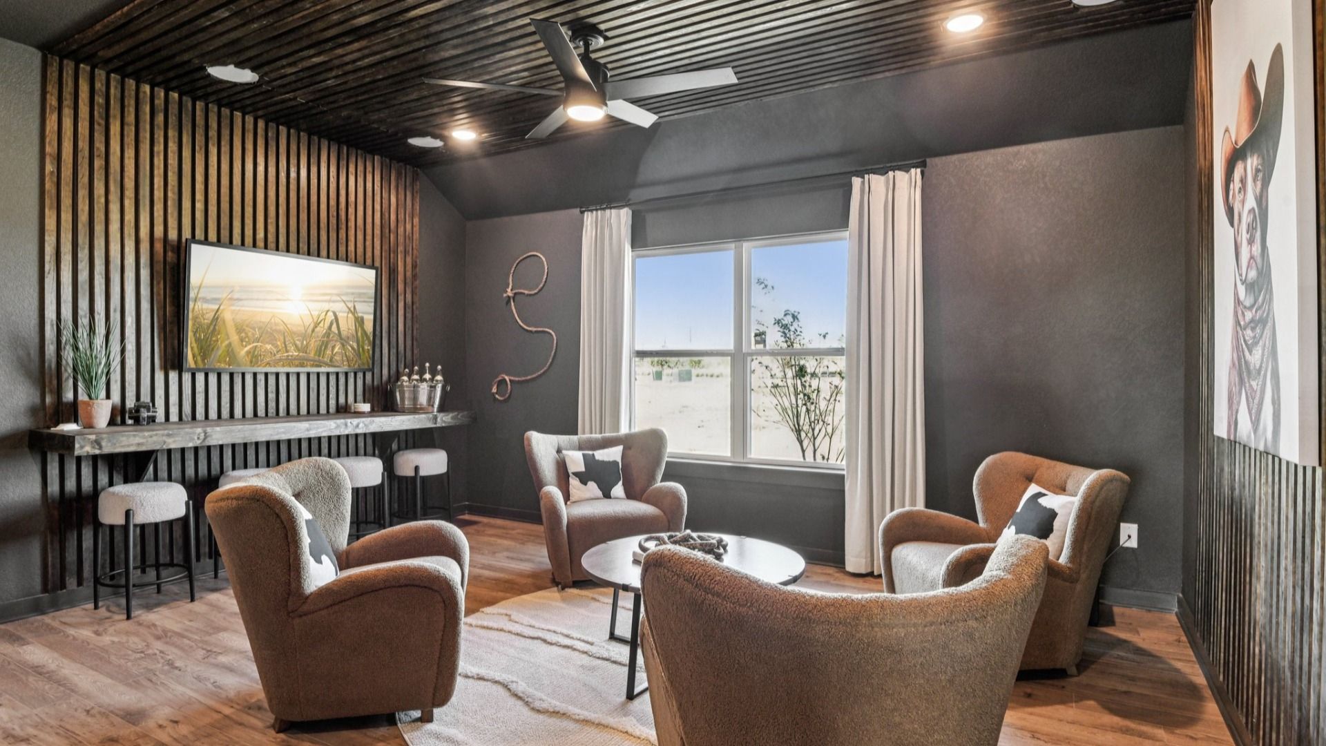 Game Room Area located behind the kitchen, featuring an additional closet and a ceiling fan