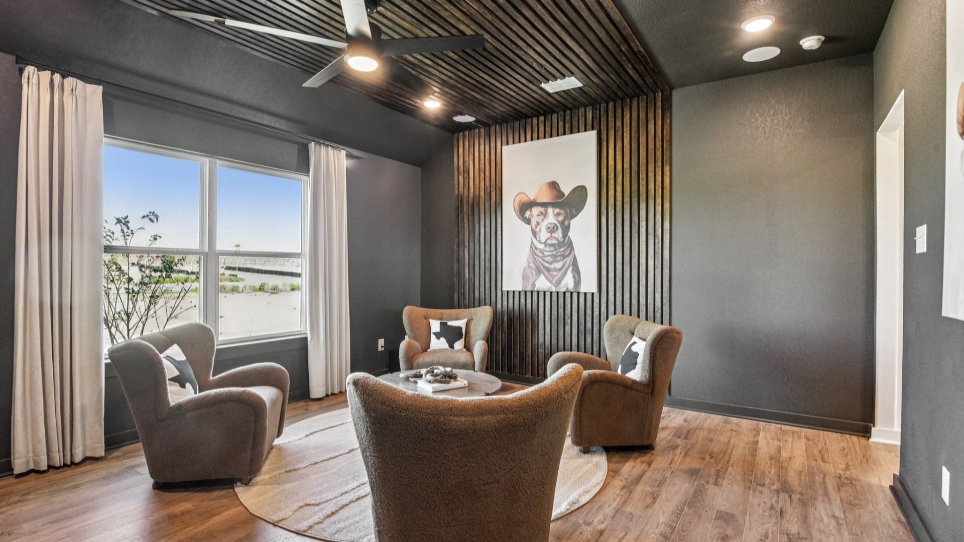 Game Room Area located behind the kitchen, featuring an additional closet and a ceiling fan