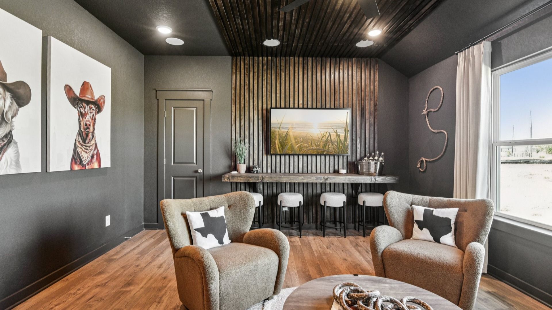 Game Room Area located behind the kitchen, featuring an additional closet and a ceiling fan