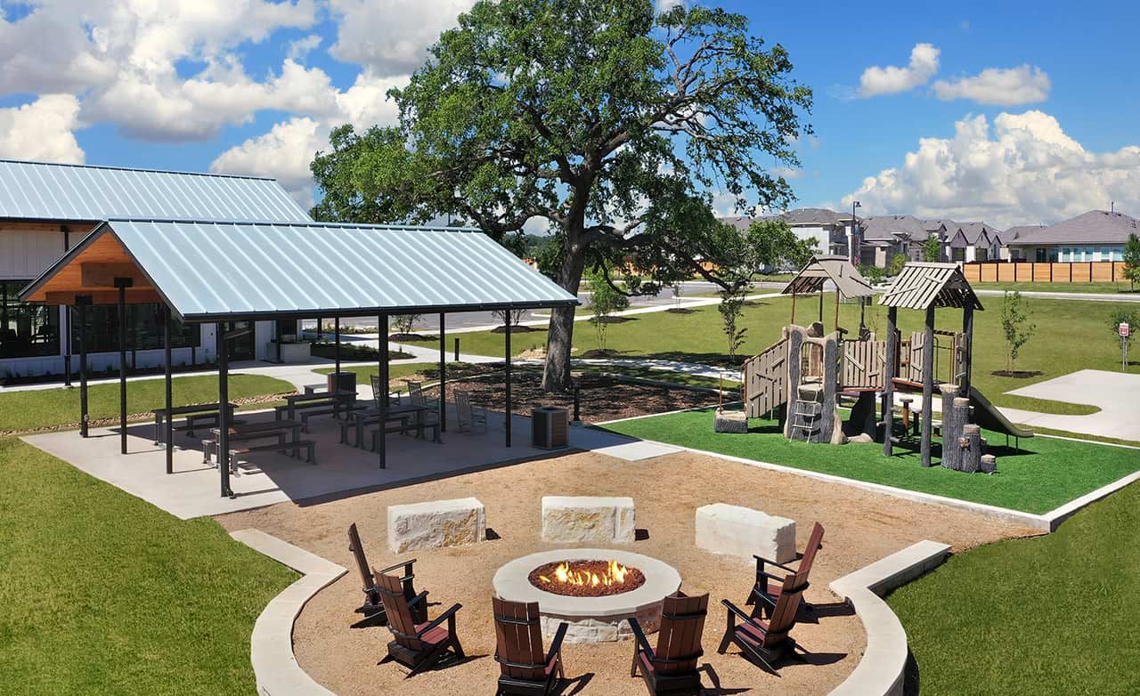 Elegant pavilion and cozy firepit at Meyer Ranch, Texas offer refined outdoor leisure in a serene community setting.