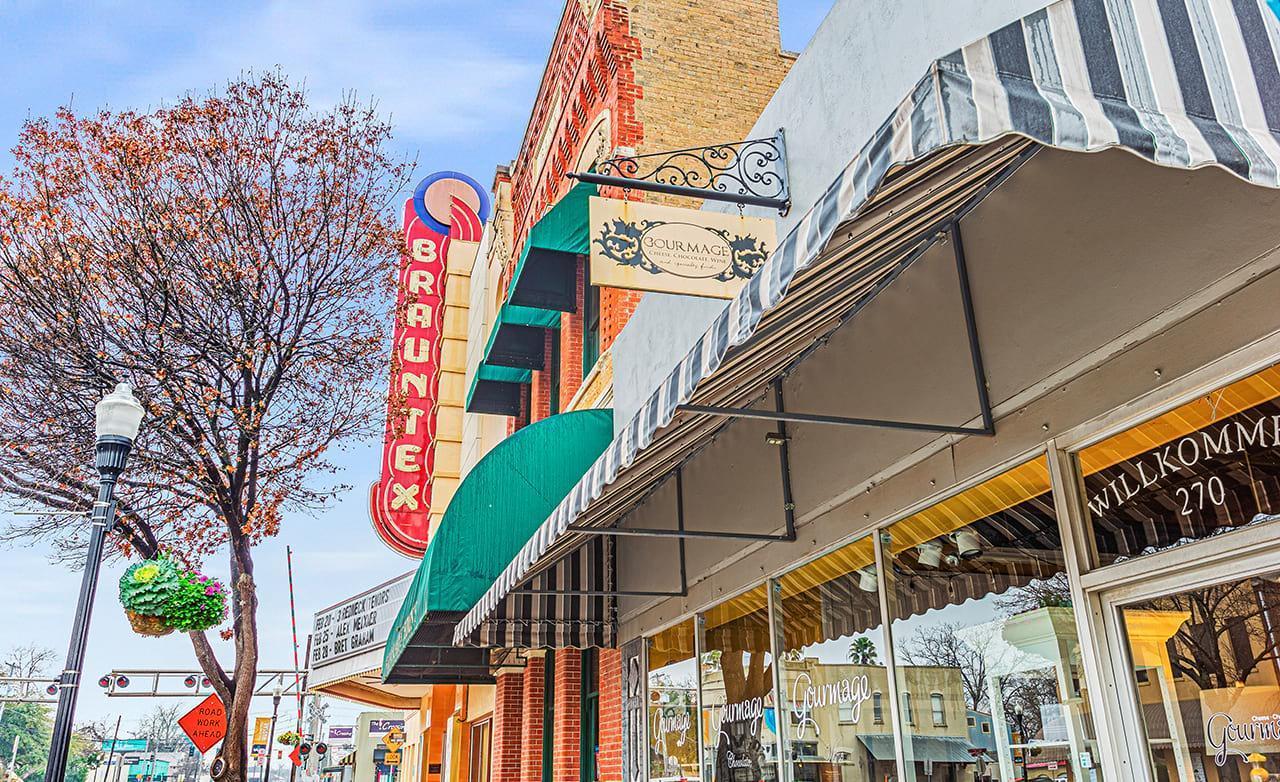 Experience classic charm with Brauntex Theatre's vintage neon and intricate brickwork in New Braunfels.
