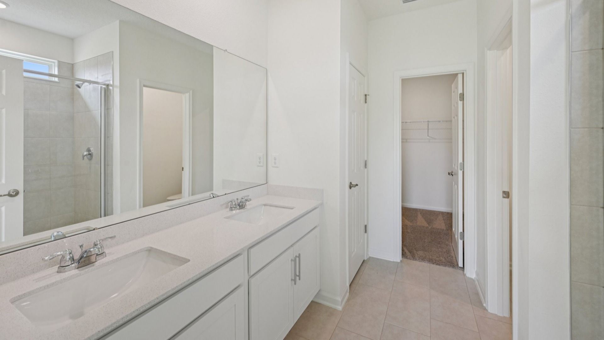 The Fleetwood Floor Plan Primary Suite Bath with Dual Sinks by DRB Homes in Panther Creek New Jacksonville Home Community