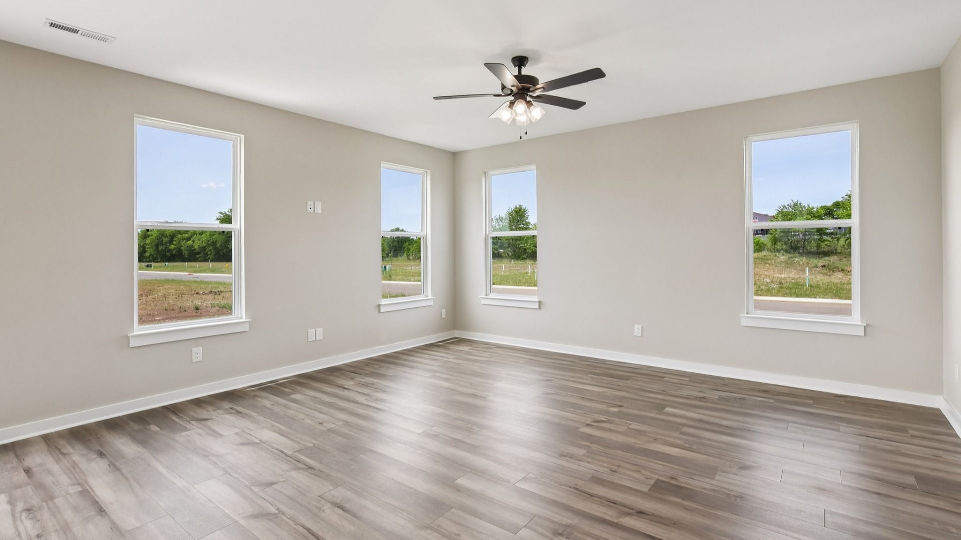 Living Room with hard surface flooring and large windows