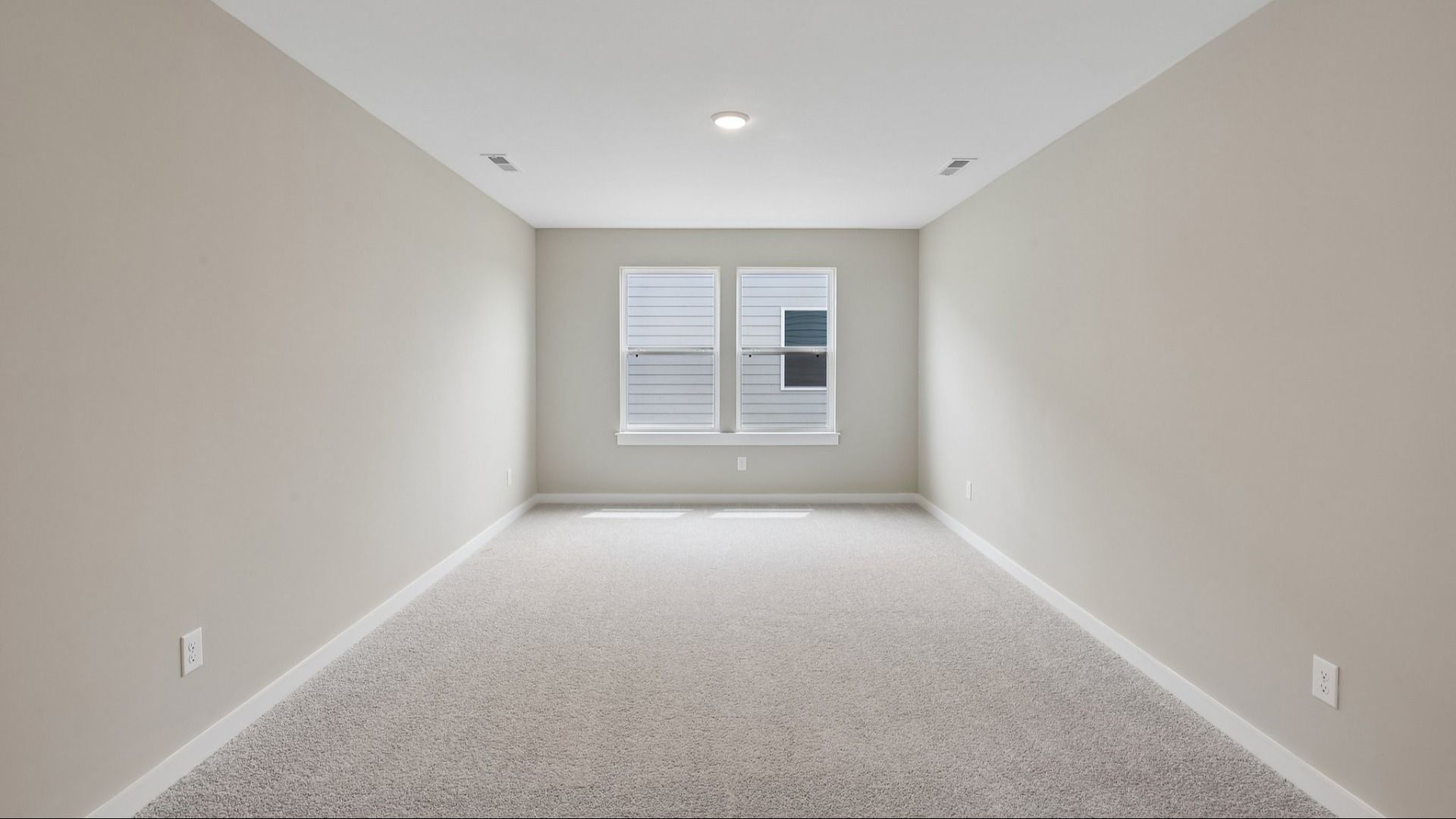 Second Floor Loft area with windows and carpet