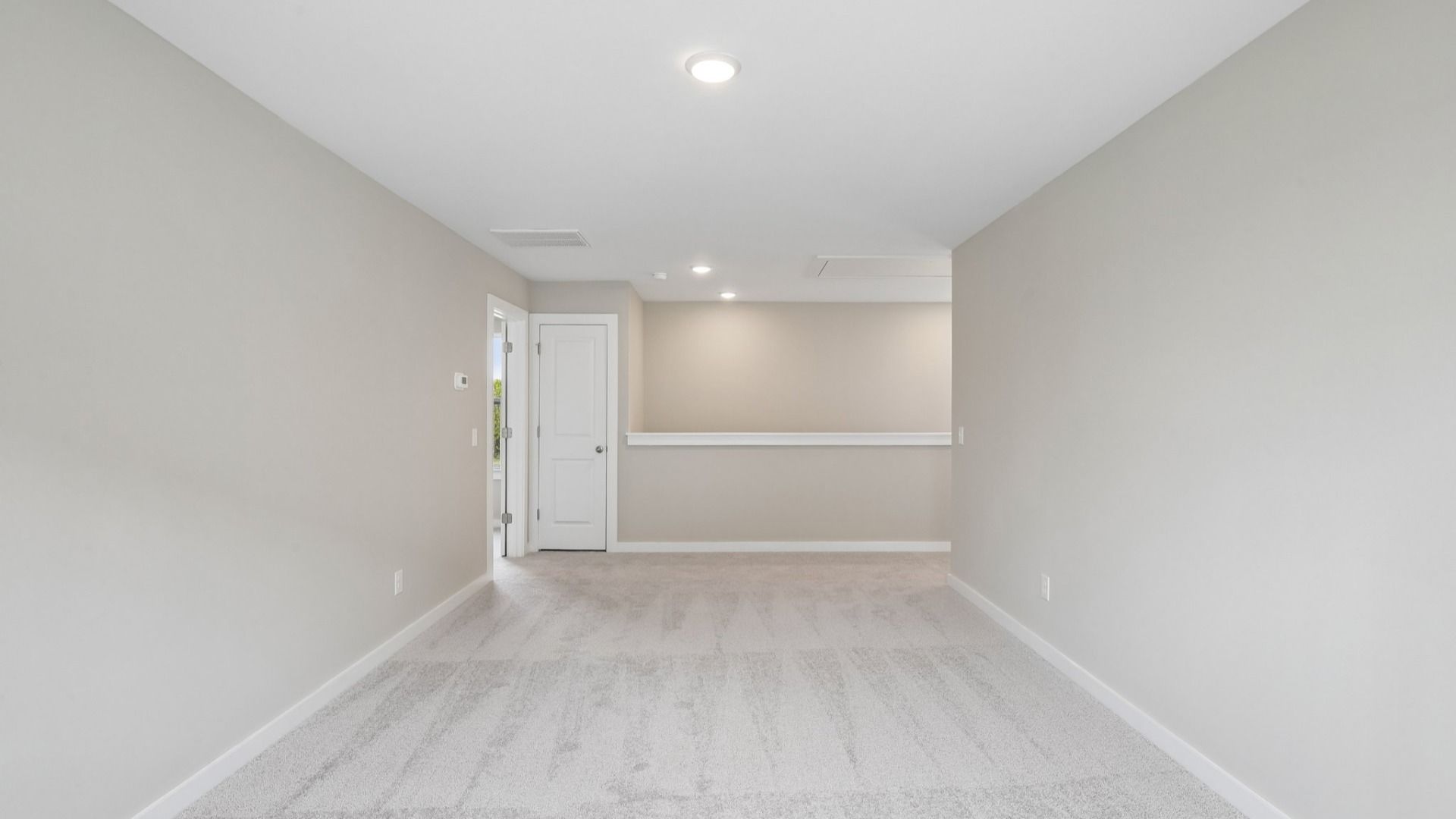 Second Floor Loft area with view of stairs and carpet