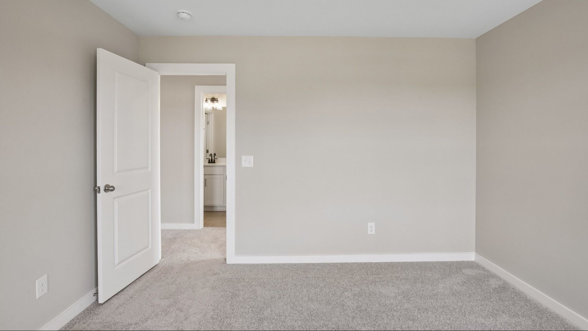 Bedroom with nearby bathroom