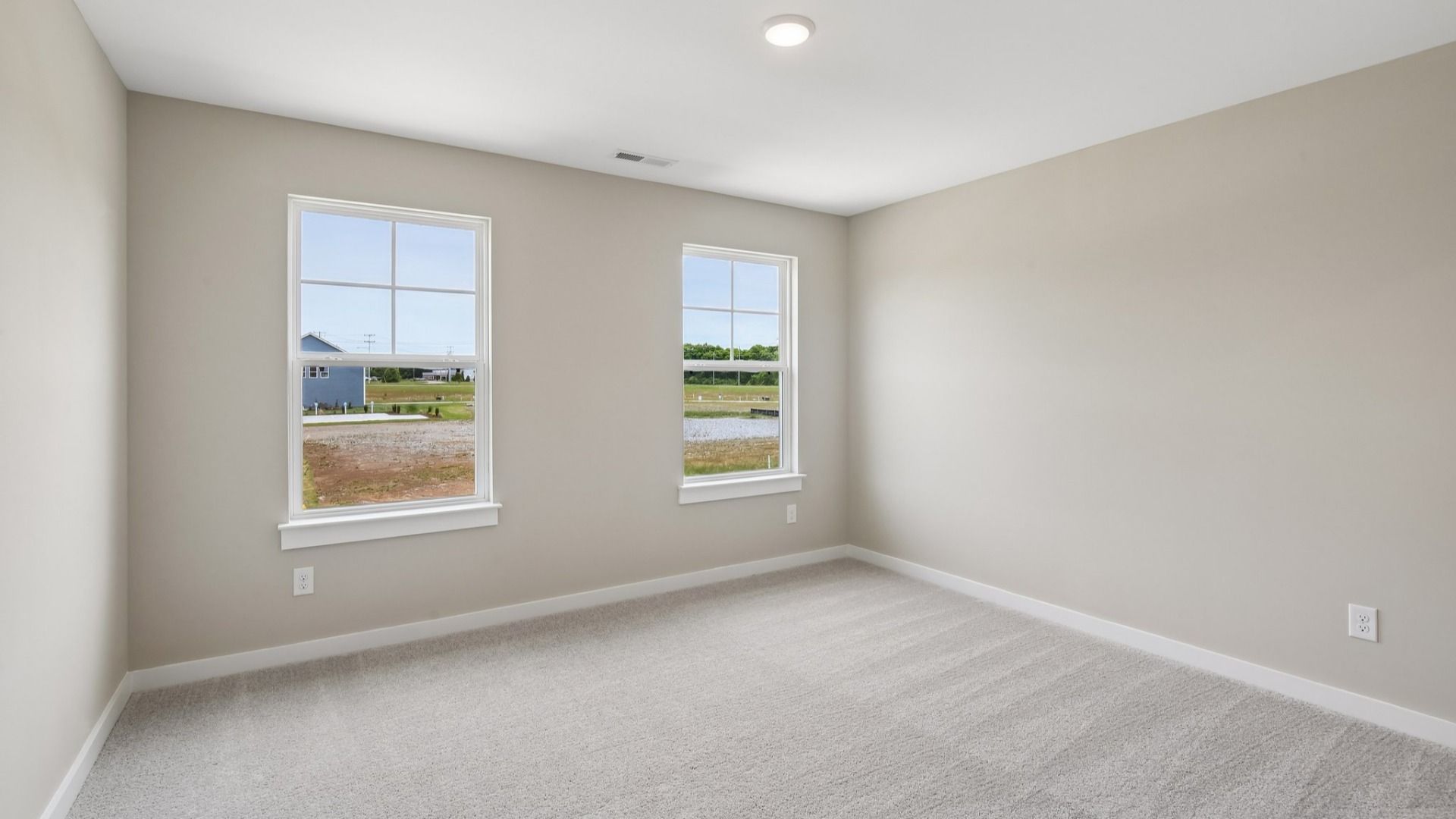 Secondary Bedroom with two windows