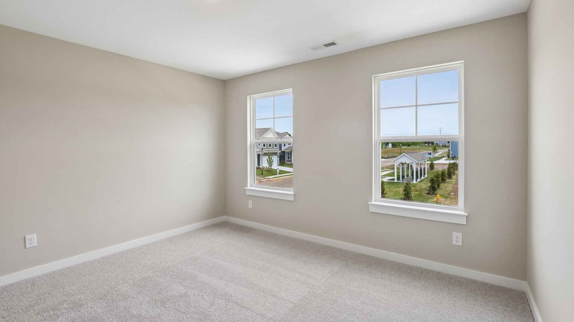 Secondary Bedroom with two windows