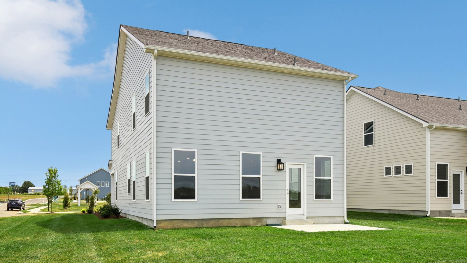 Backyard of home with small back patio