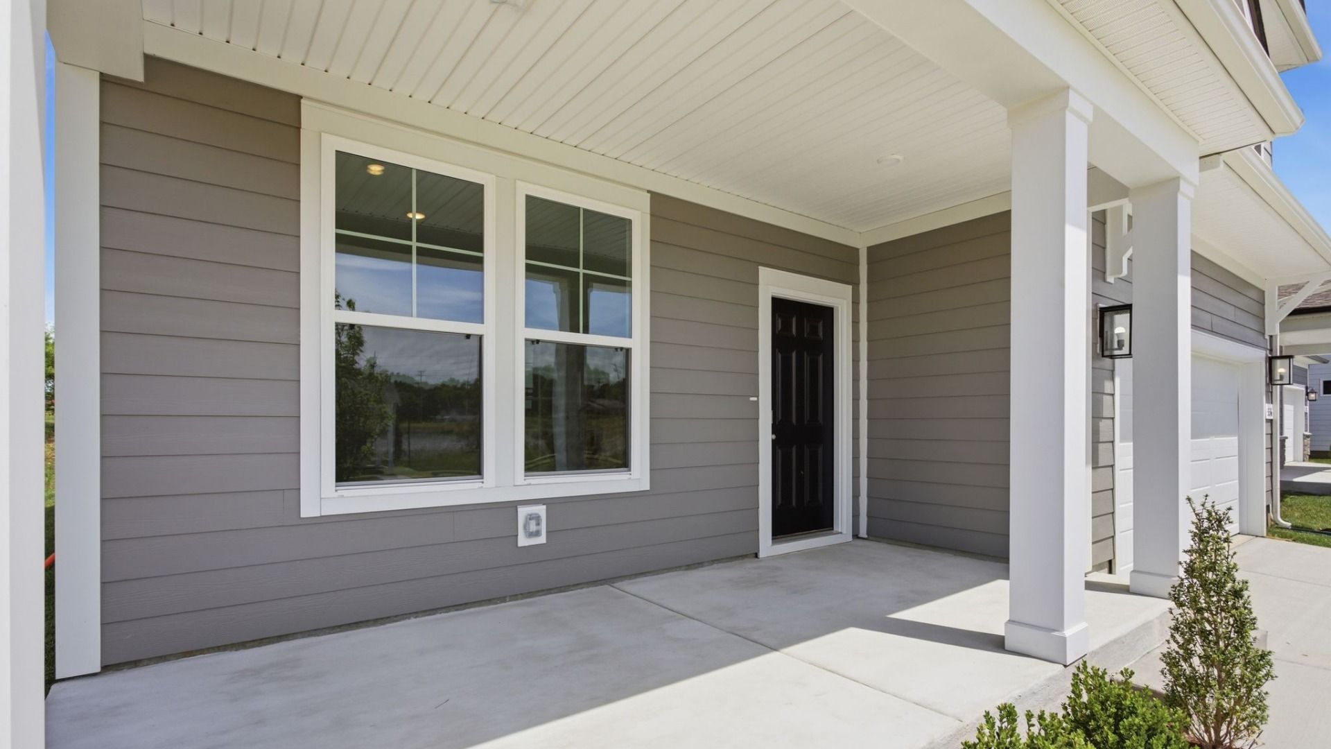 Exterior entryway with black door