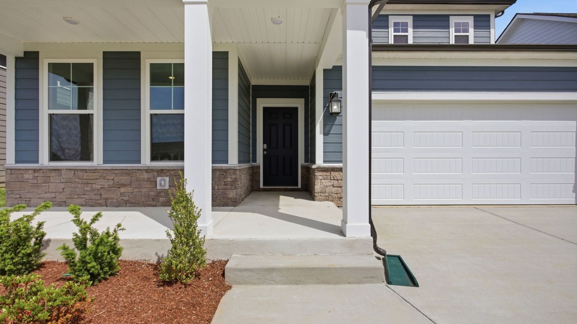 Covered entry with black door