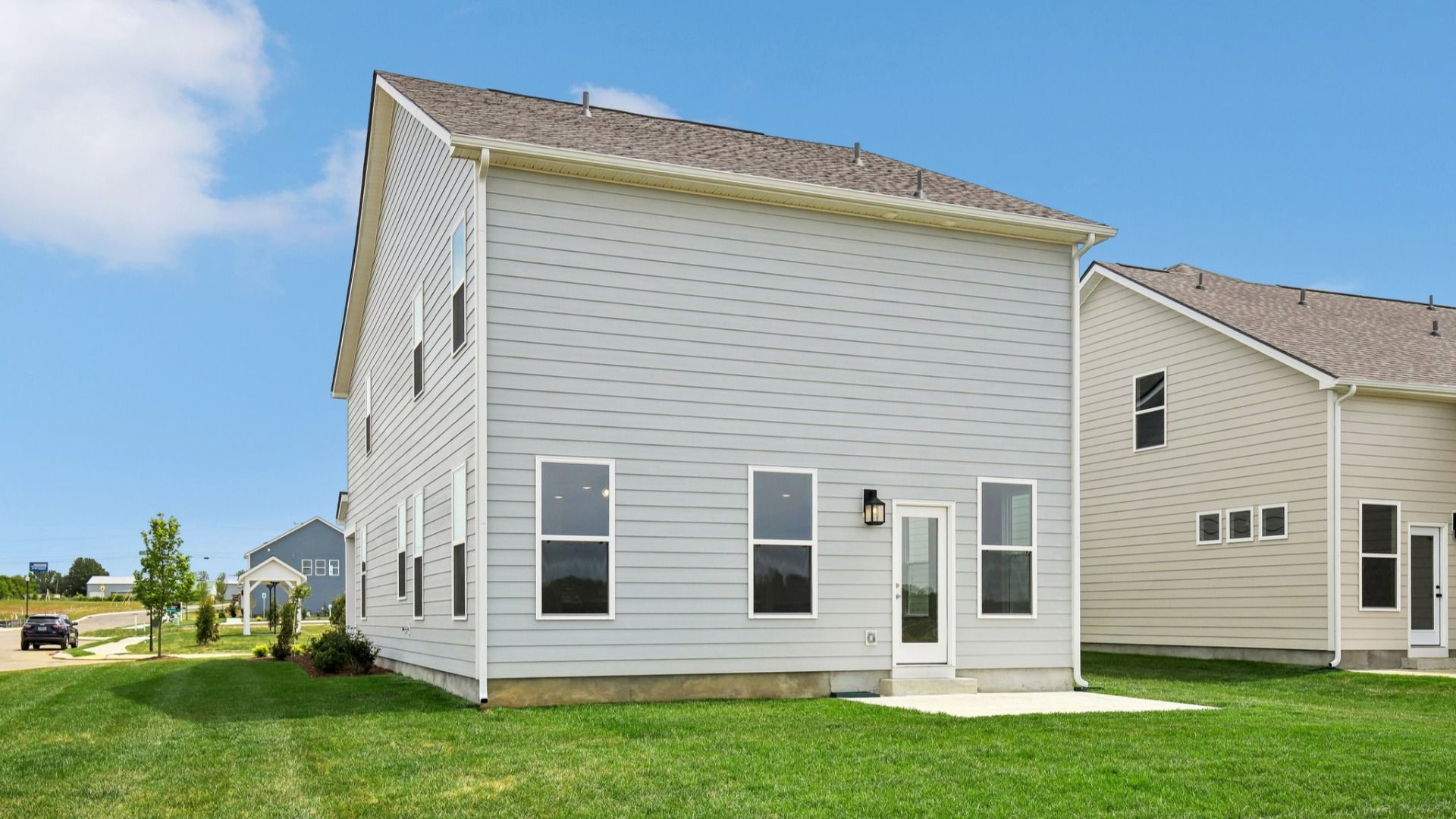 Backyard of home with small back patio