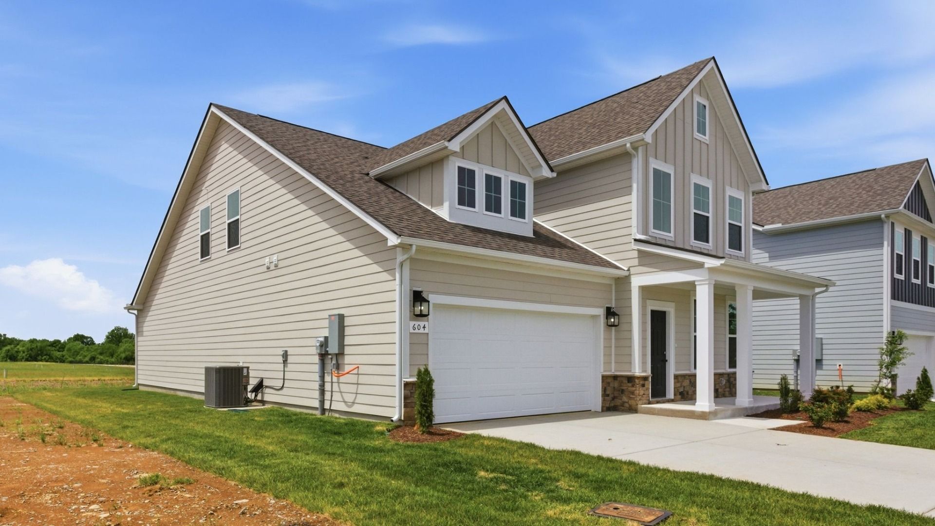 Home Exterior with two types of siding and two car garage