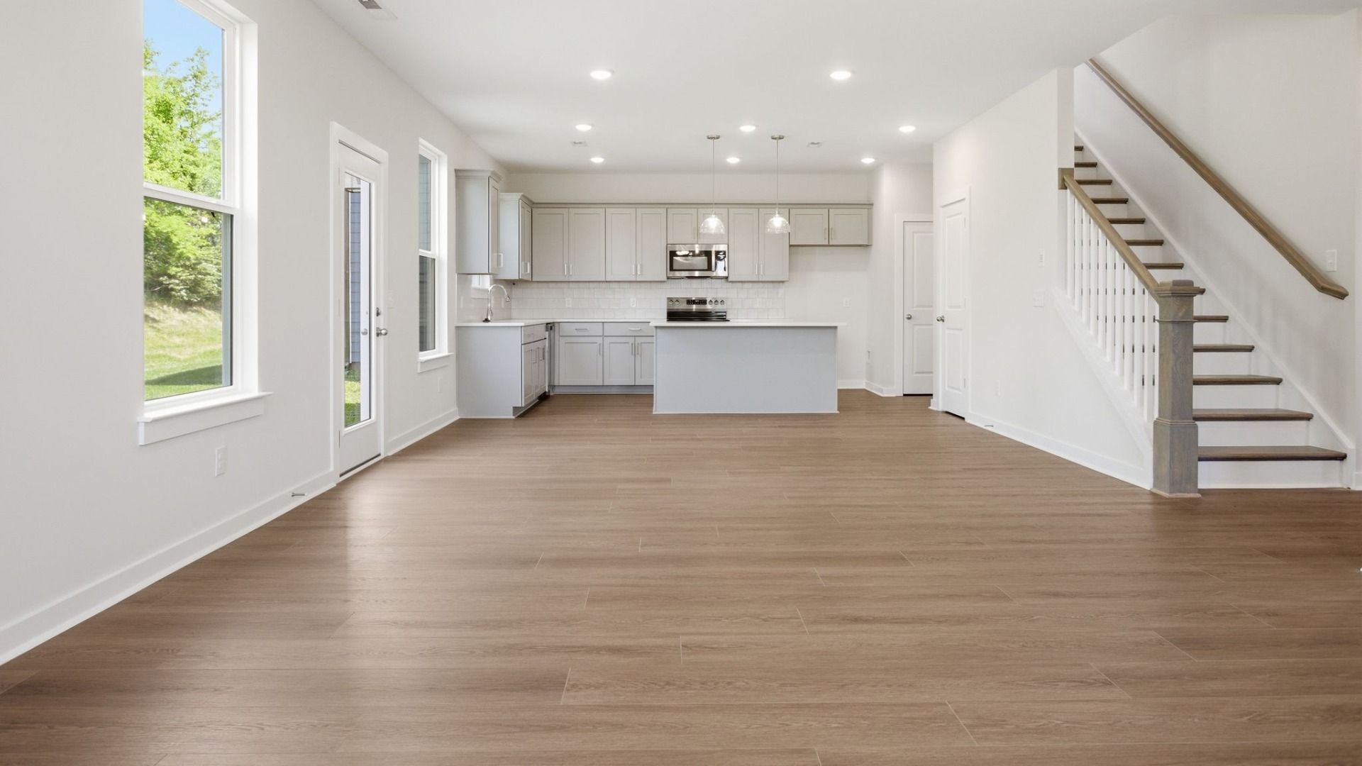 Dining area with view of kitchen and staircase