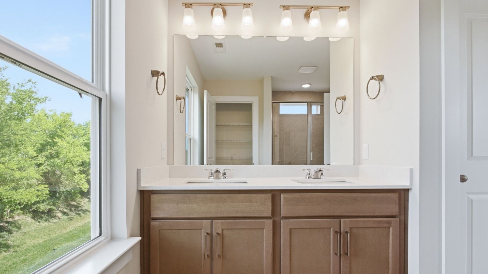 Bathroom with window and double vanity