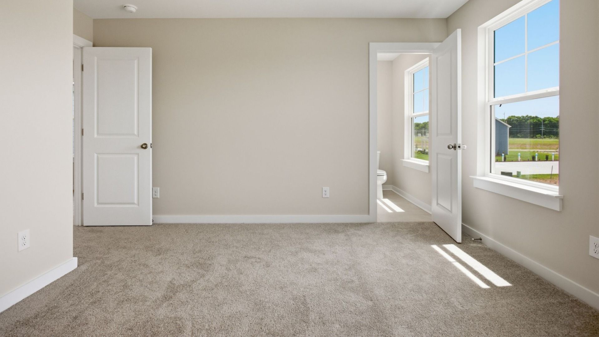 Room with window and access to secondary bathroom