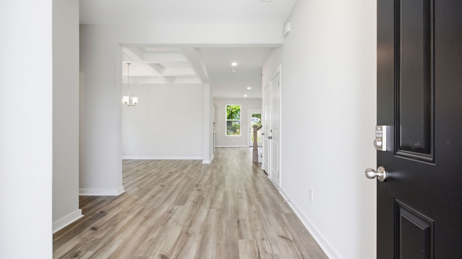 Interior Entry point with black door and hard surface flooring