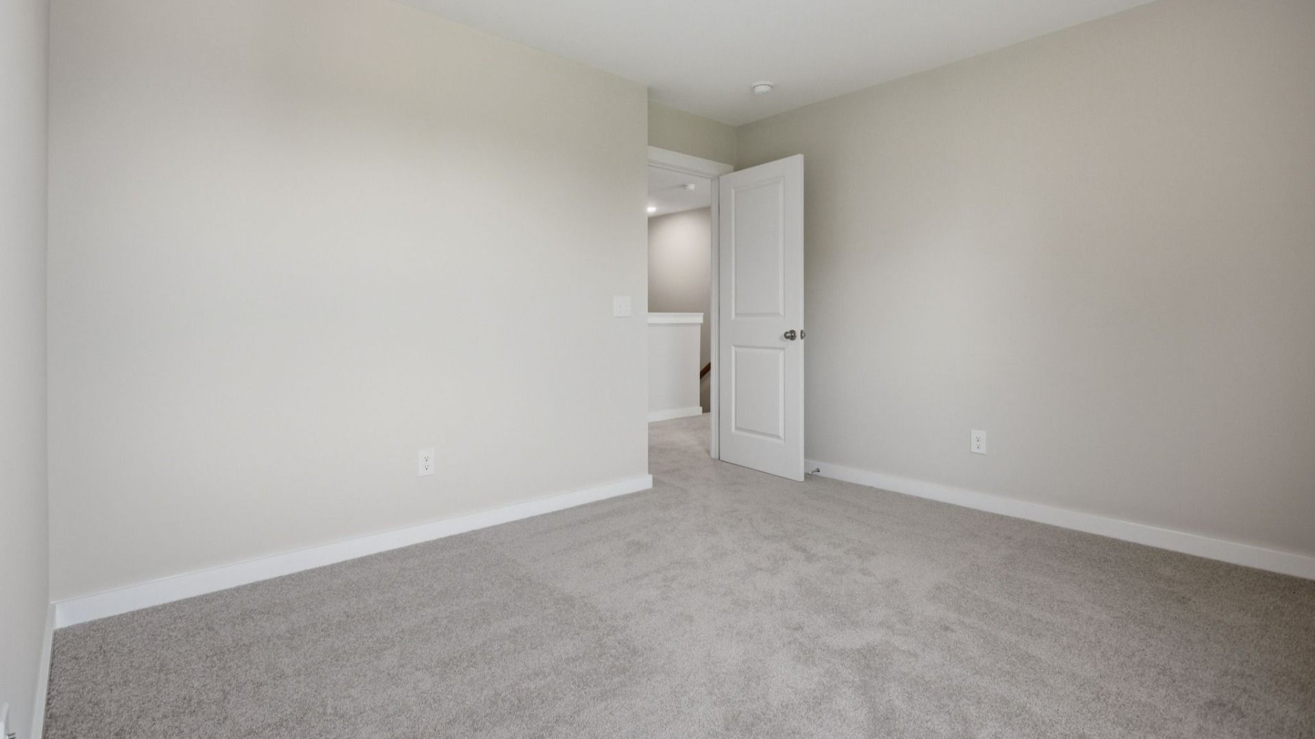 Bedroom with nearby stairs and access to loft