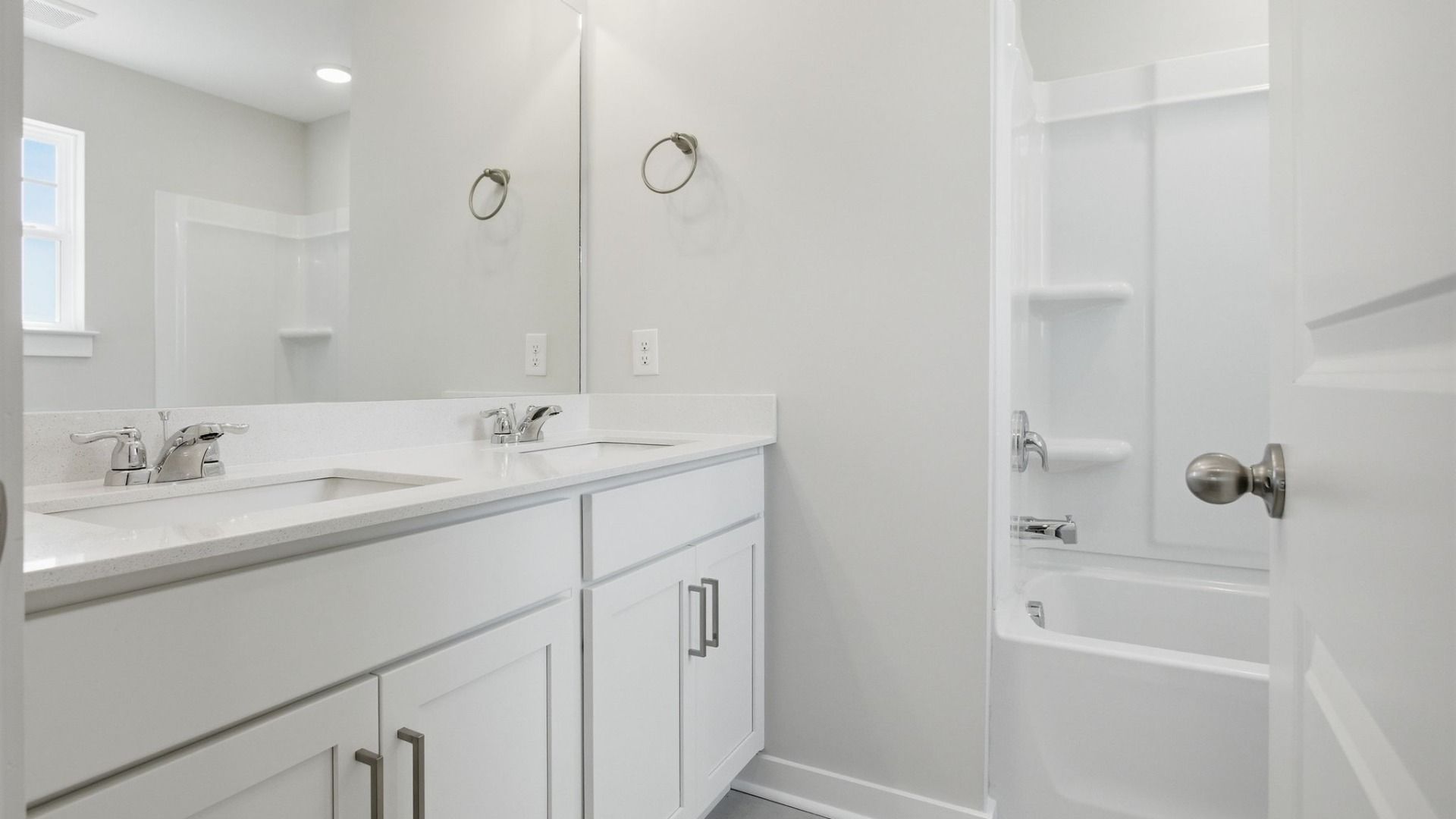 Bathroom with dual vanity and shower