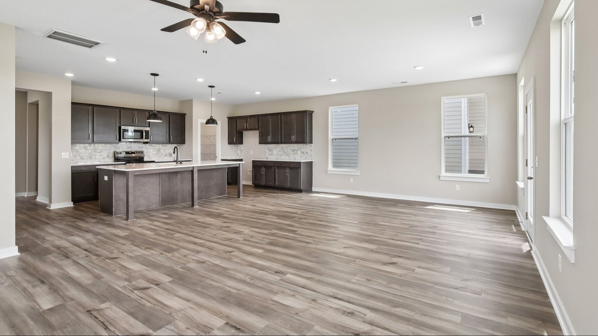 First Floor with hard surface flooring and kitchen