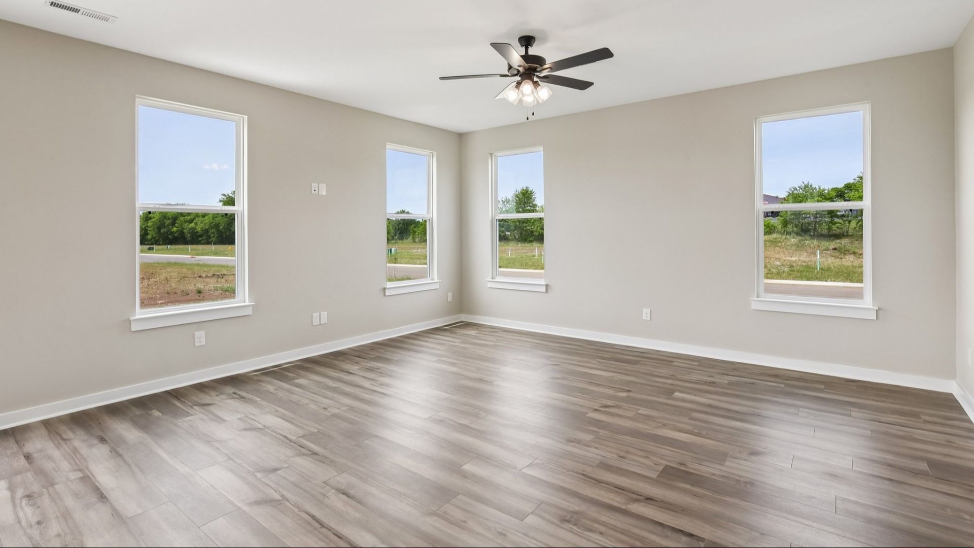 Living Room with hard surface flooring and large windows
