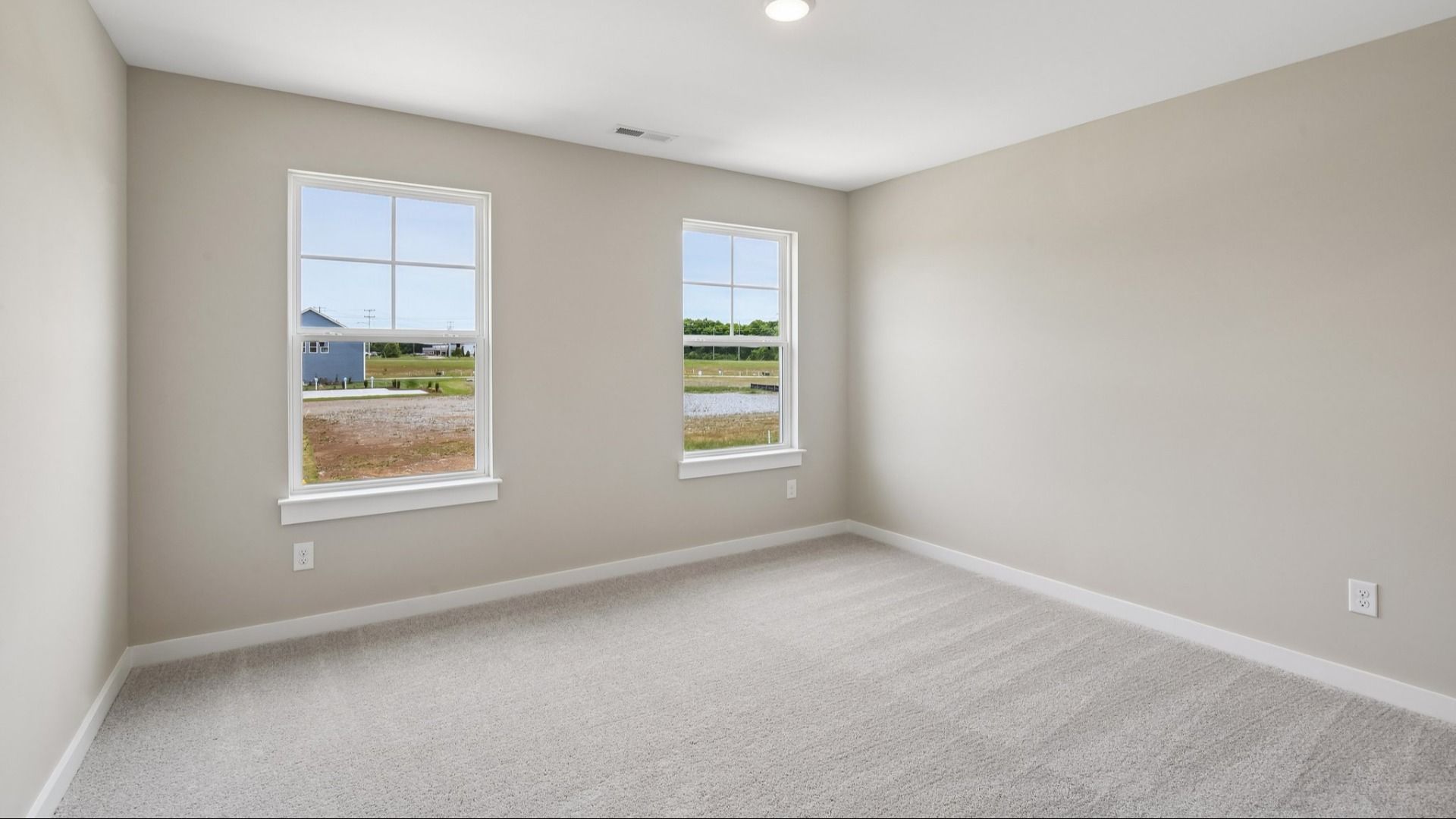 Secondary Bedroom with two windows