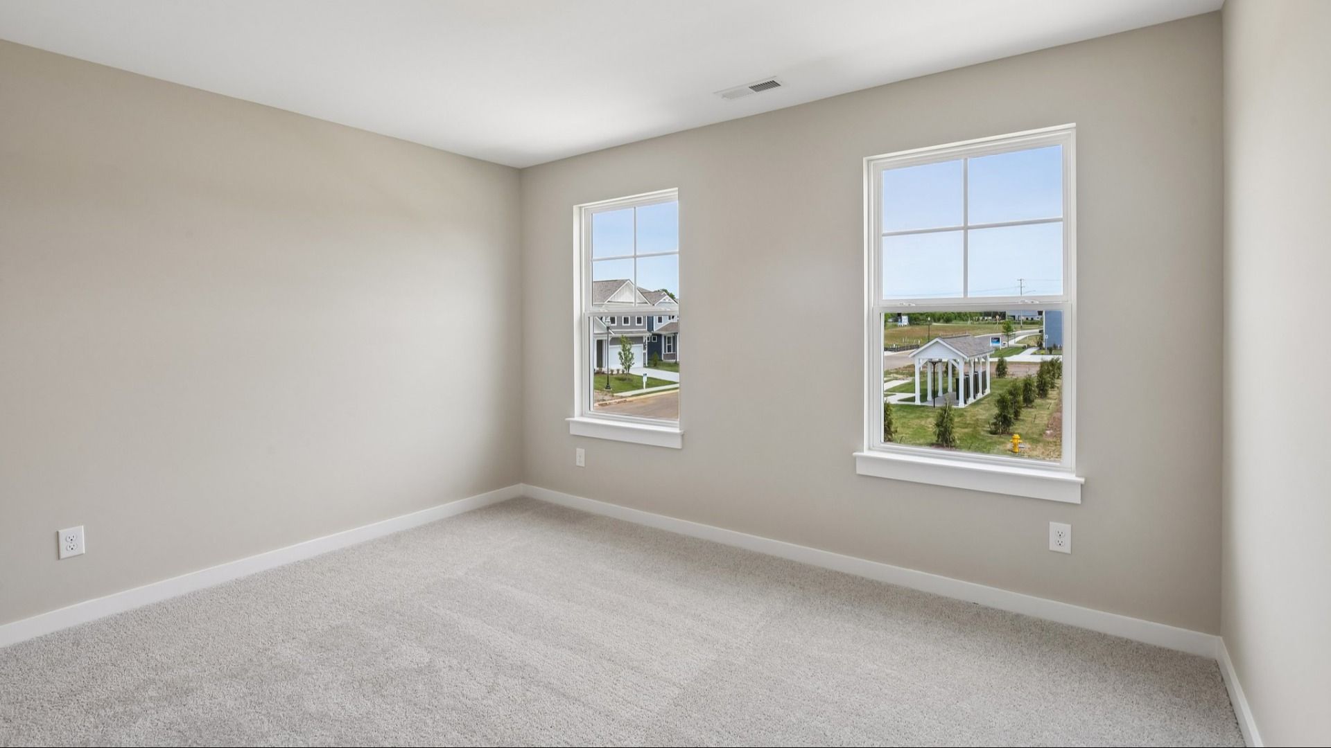 Secondary Bedroom with two windows