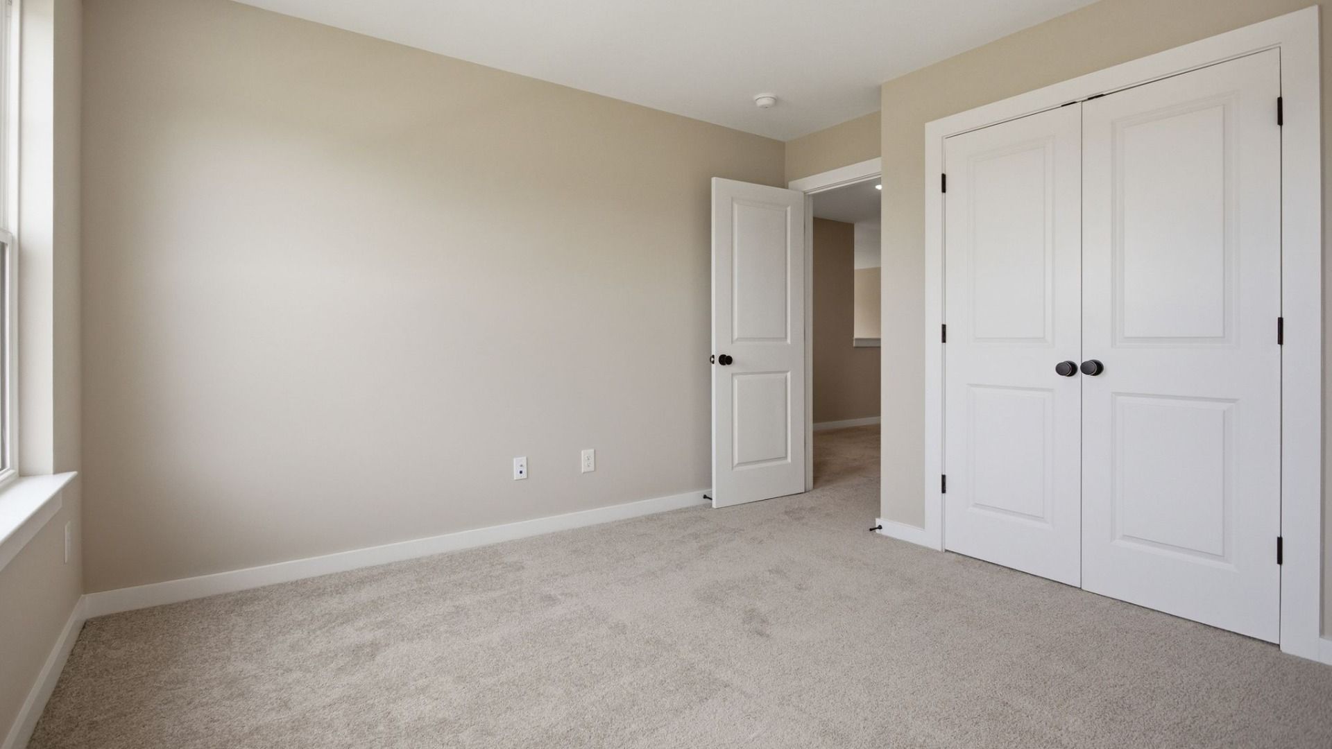 Bedroom with window and closet