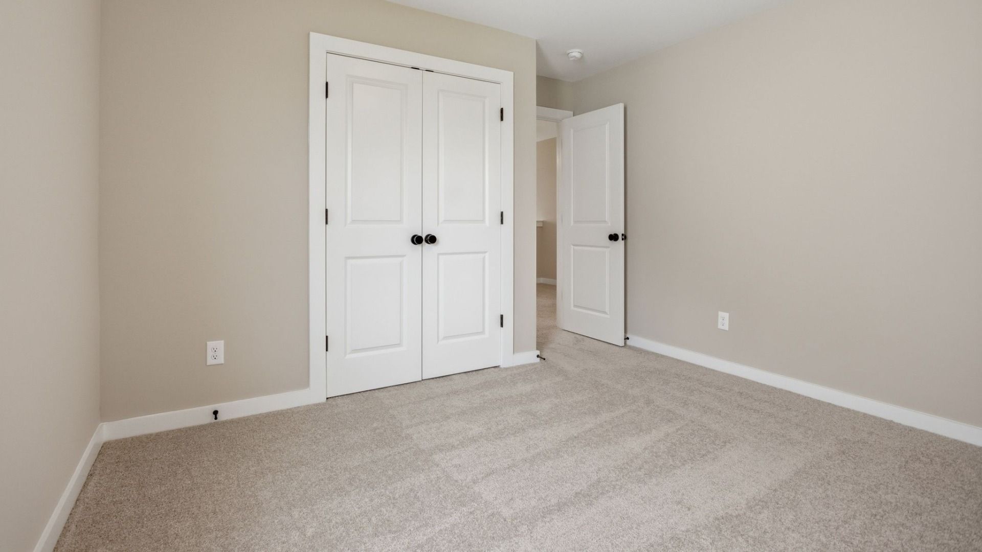 Bedroom with closet and access to loft area
