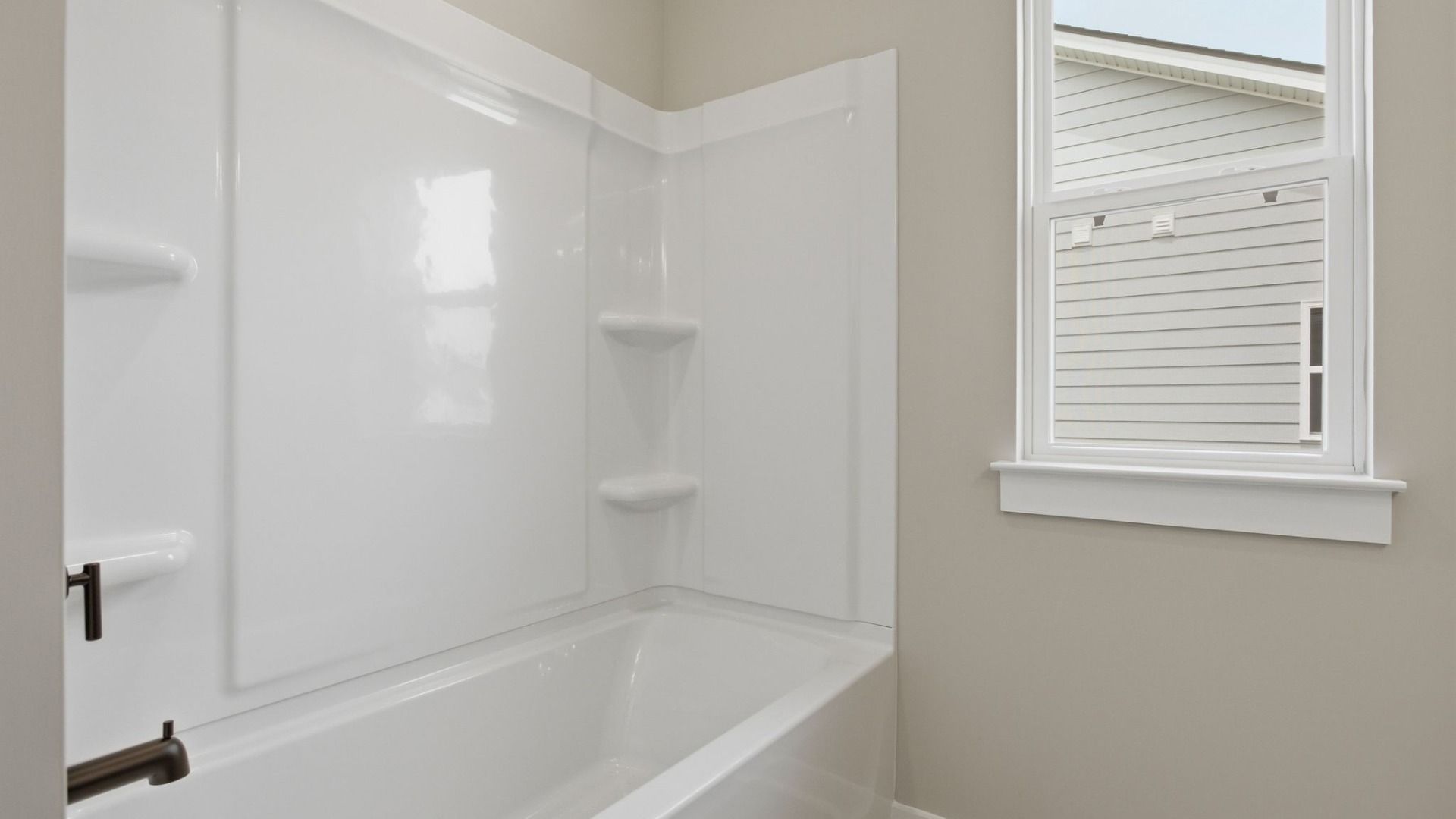 Bathroom with shower and window
