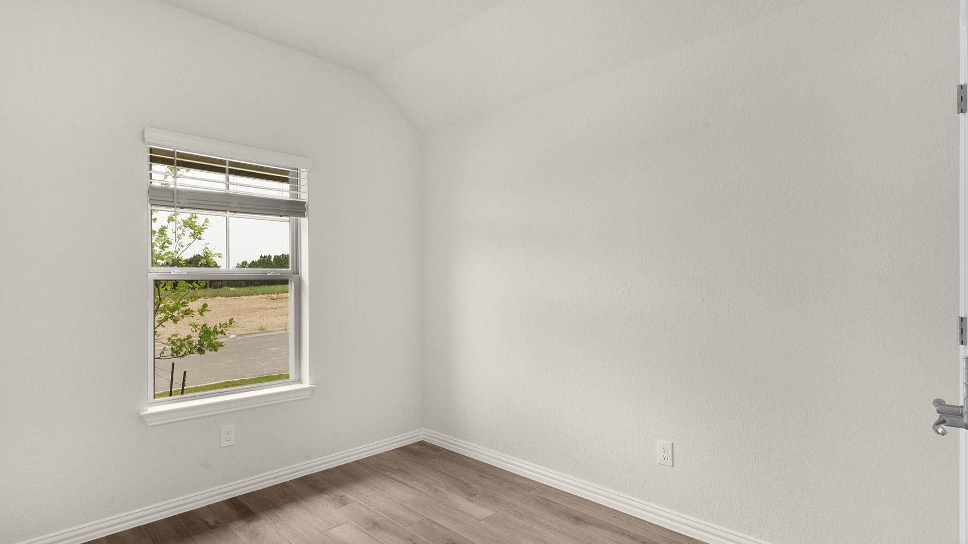 Dedicated home office with natural light and a calm, focused setup for productivity and comfort.