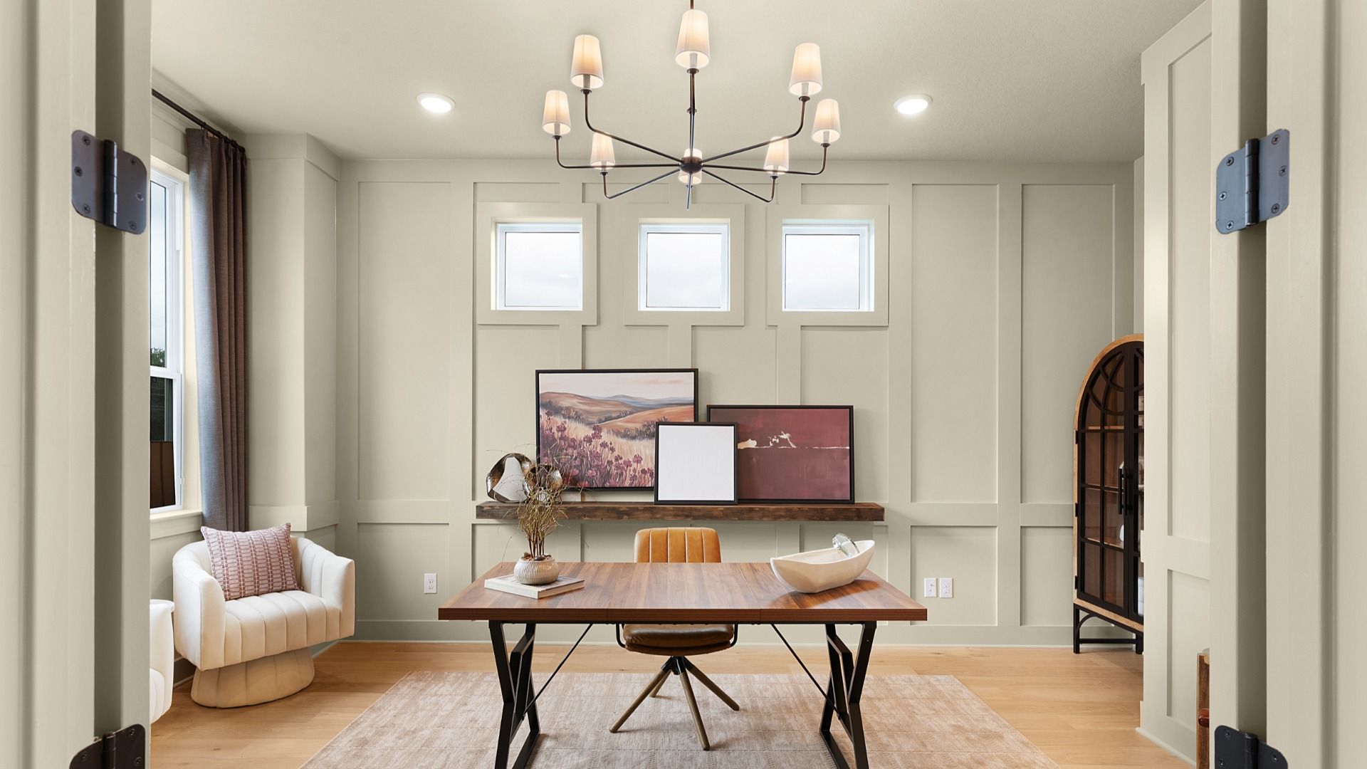Dedicated office with abundant natural light, creating a calm, modern workspace design.