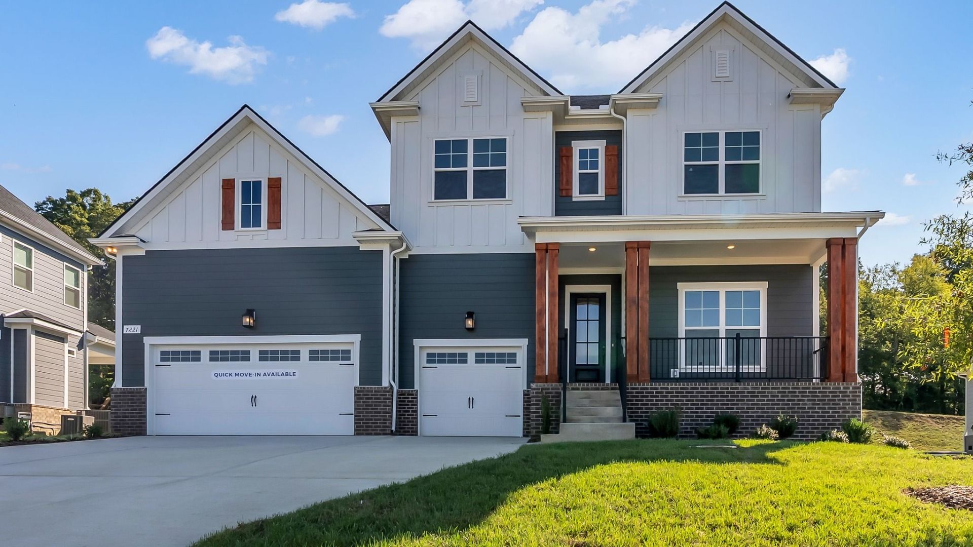 Beautiful front exterior with two color siding and 3-car garage