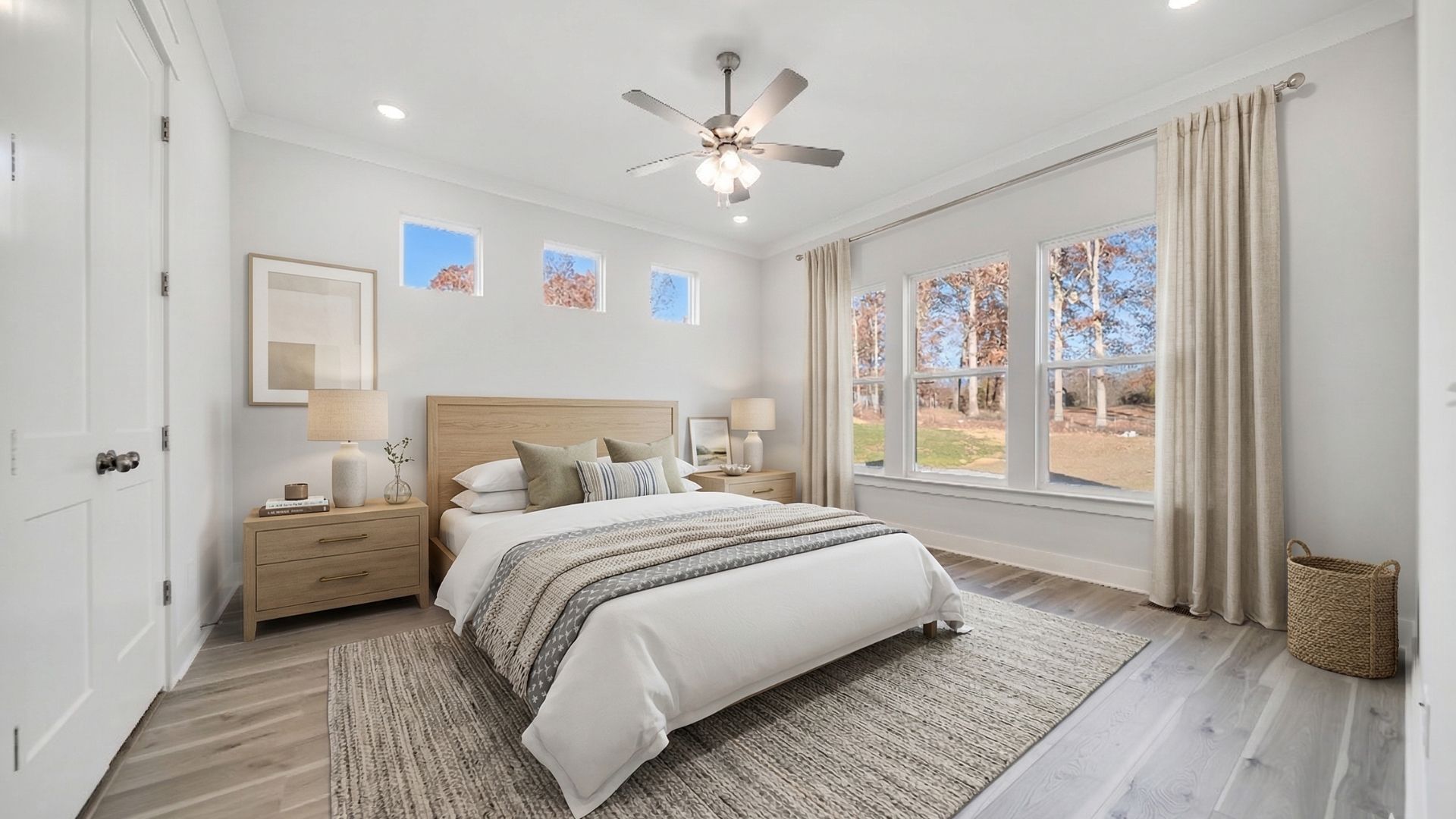 Bedroom with natural light from windows, ceiling fan, and hard surface flooring