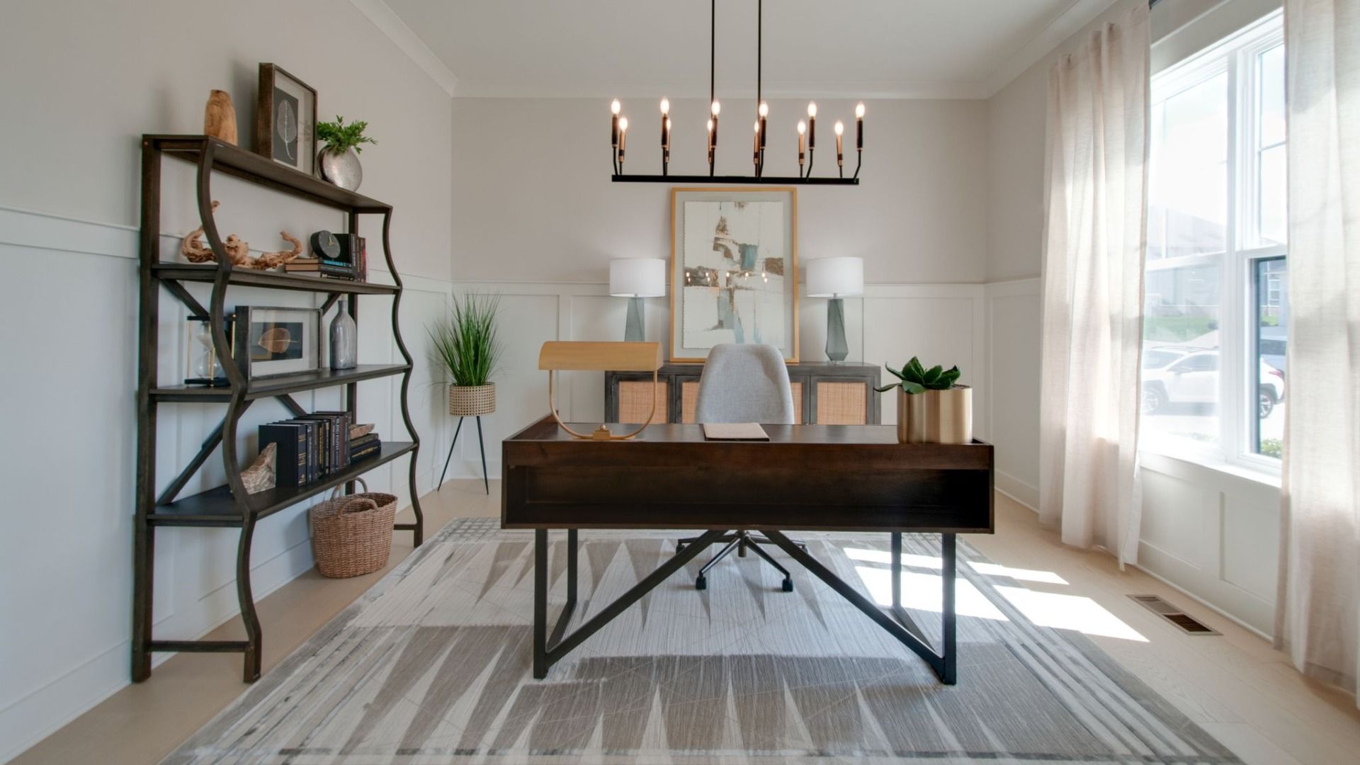 Study with chandelier, hard surface flooring, and bright natural light