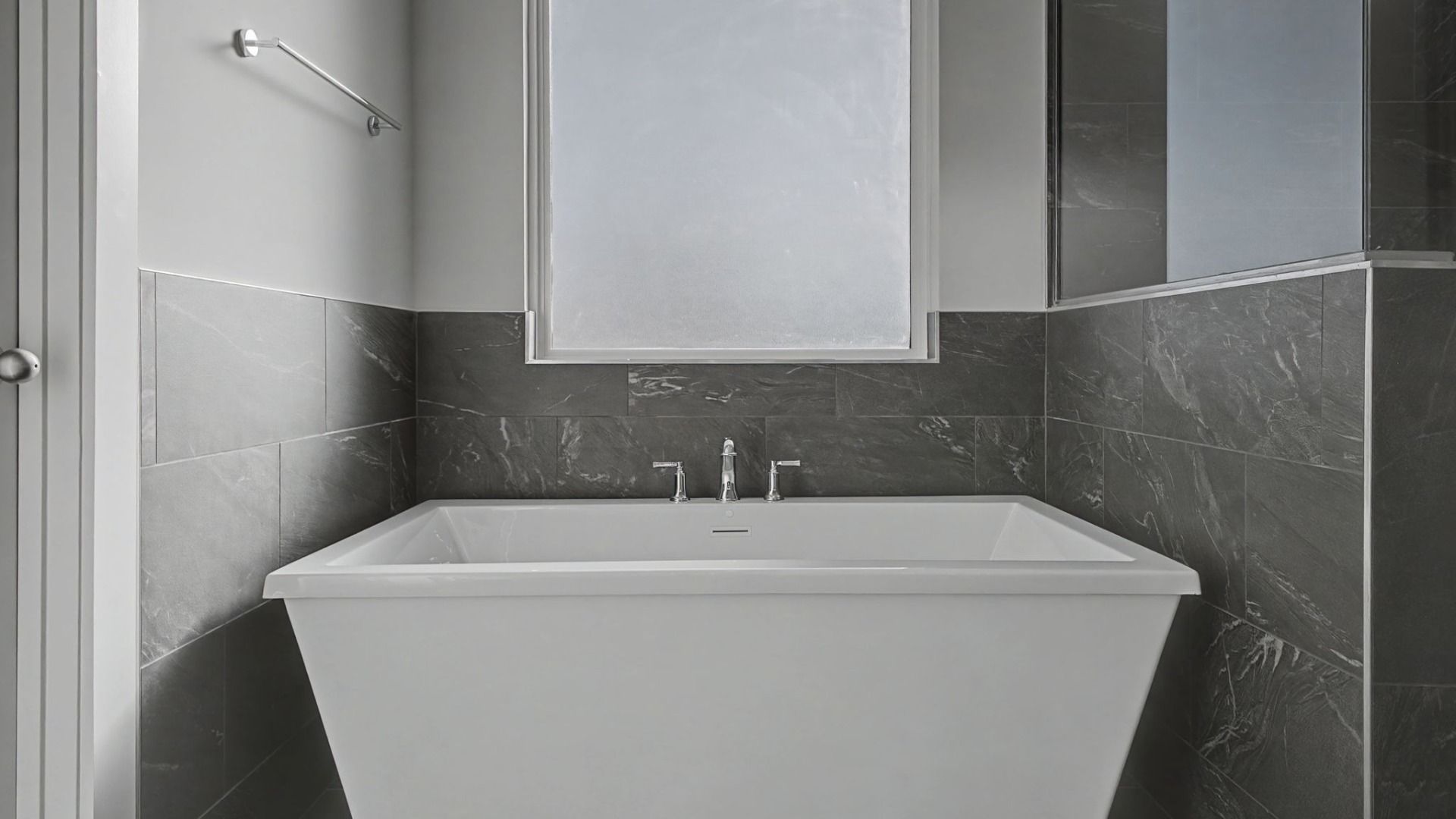 Primary Bathroom with luxurious tub with natural light from window