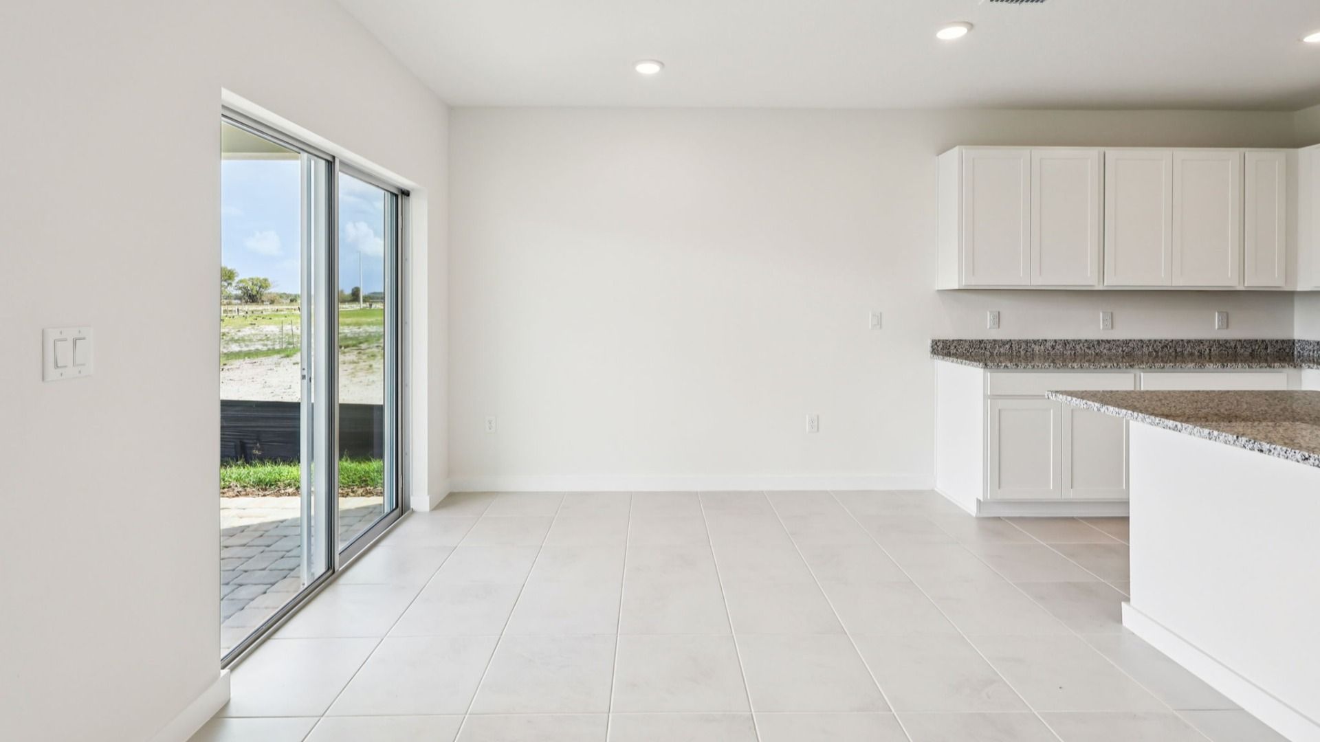 Dining and Living Area of the Baker Floor Plan by DRB Homes in Liberty Trace New Homes in Haines City