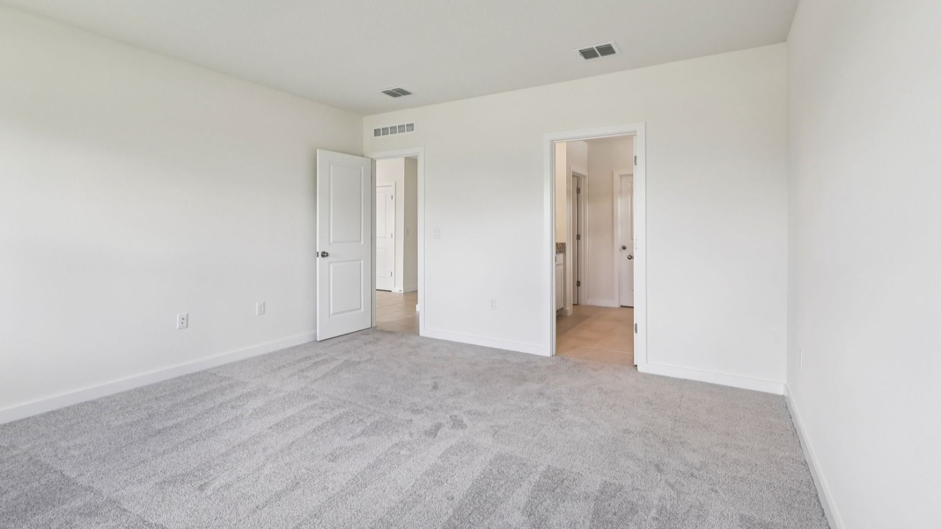 Primary Suite in the Baker Floor Plan by DRB Homes in Liberty Trace New Homes in Haines City