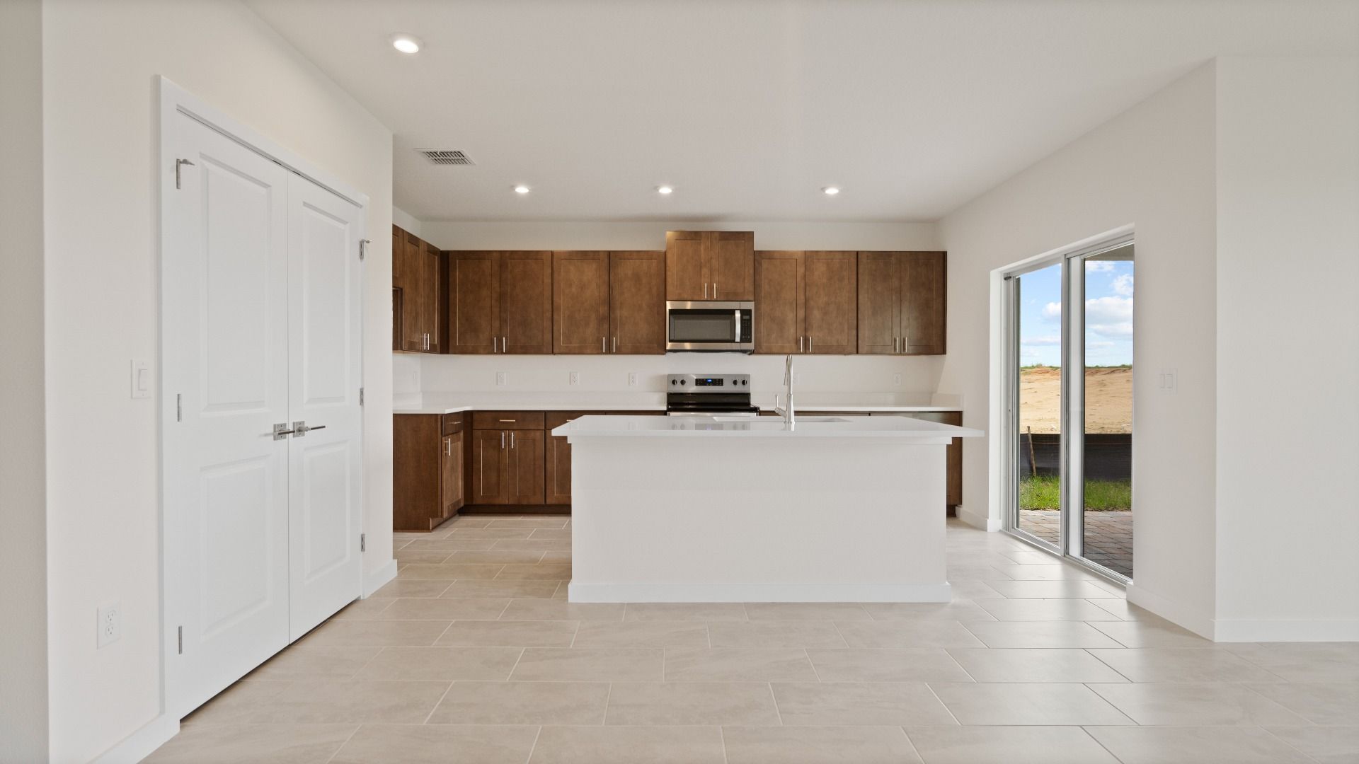 Atwood Floor Plan Kitchen and Living Area by DRB Homes in Liberty Trace New Homes in Haines City, FL
